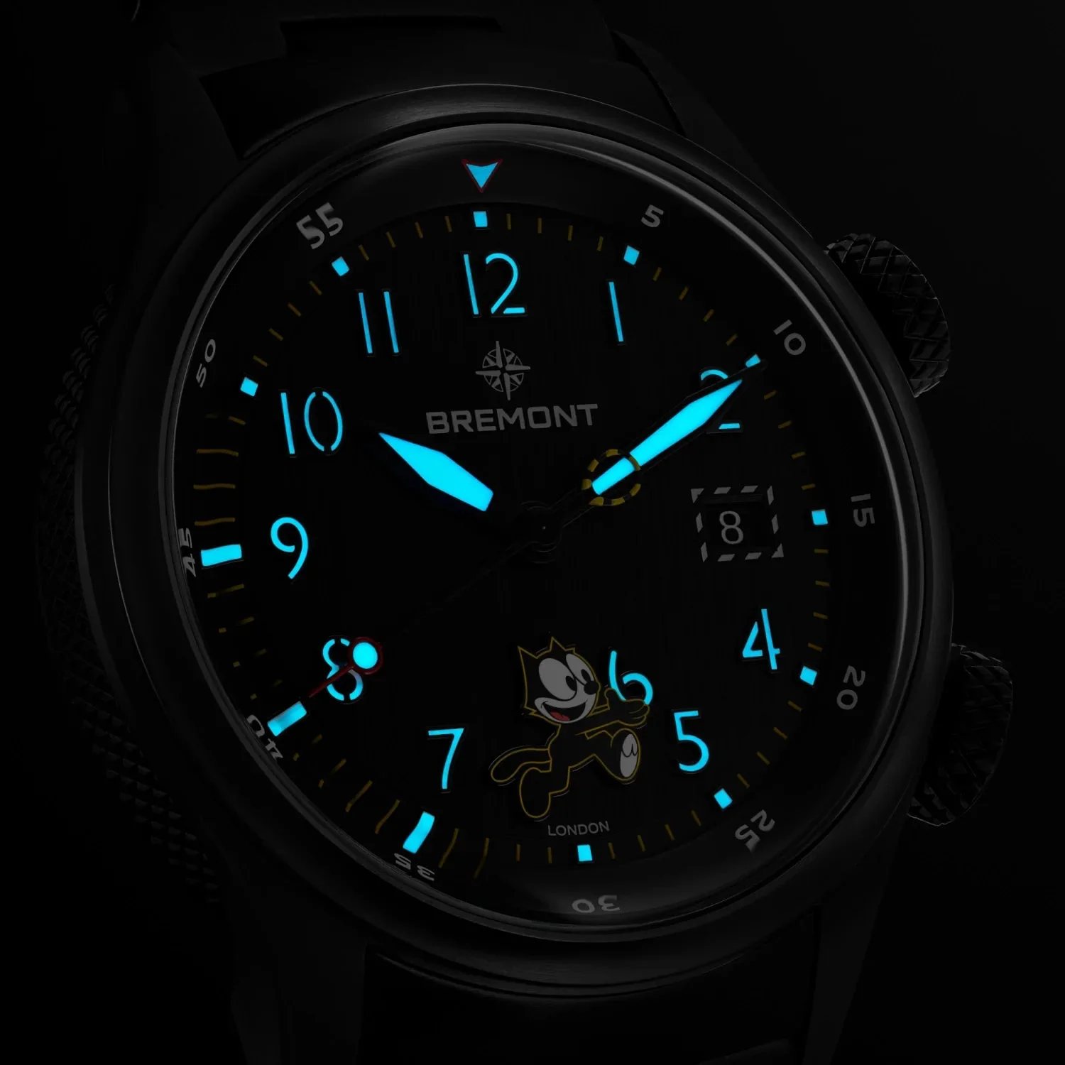 Bremont watch dial in darkness, with bright blue luminous hands, markers, and Felix the Cat.