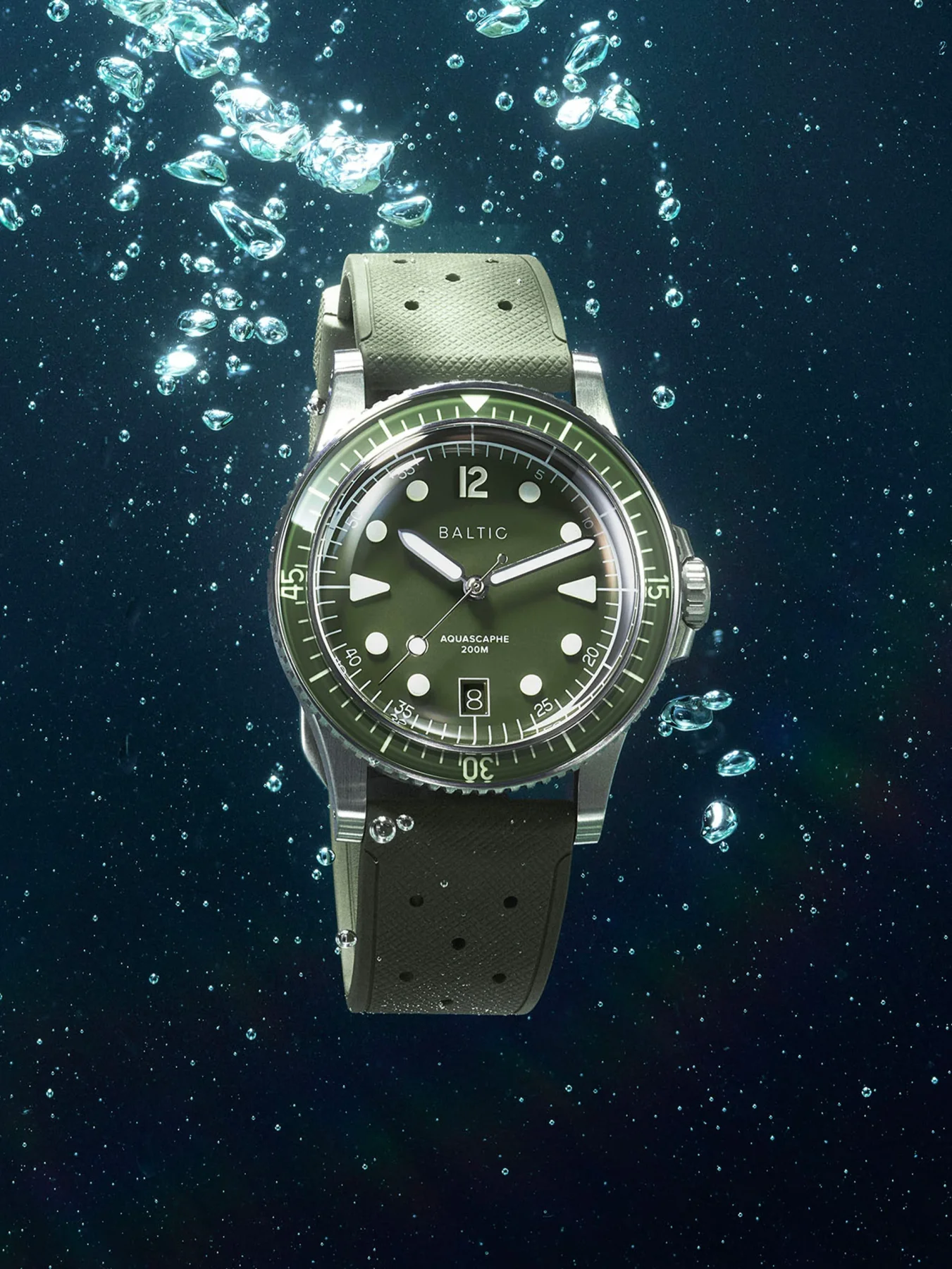 Olive green Baltic Aquascaphe 200M dive watch with rubber strap and steel case, underwater with bubbles.