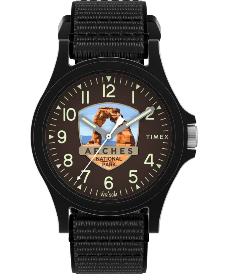 Black Timex watch with dark brown dial, Delicate Arch from Arches National Park graphic, and black nylon strap.