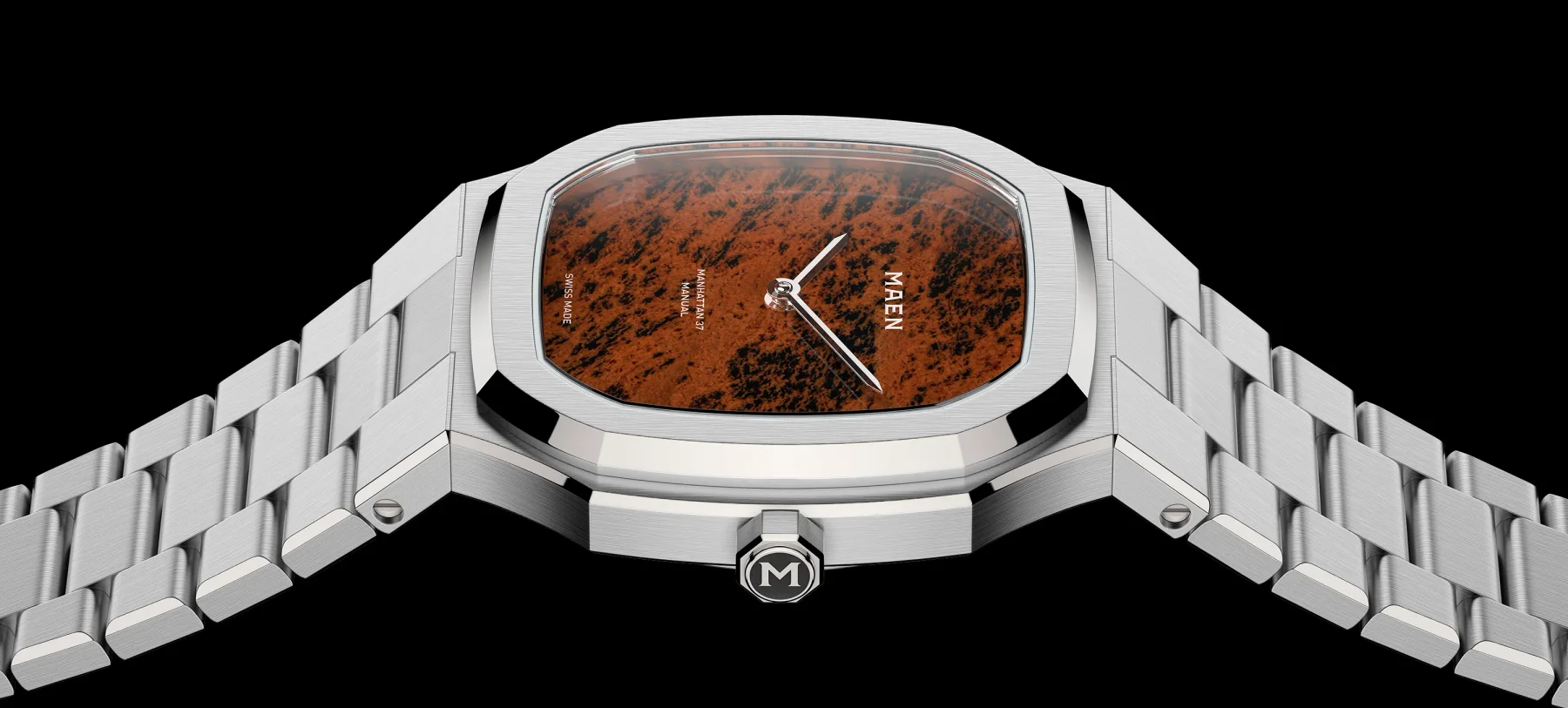 MAEN Manhattan 37 watch: silver case and integrated bracelet, reddish-brown and black textured dial. Black background.