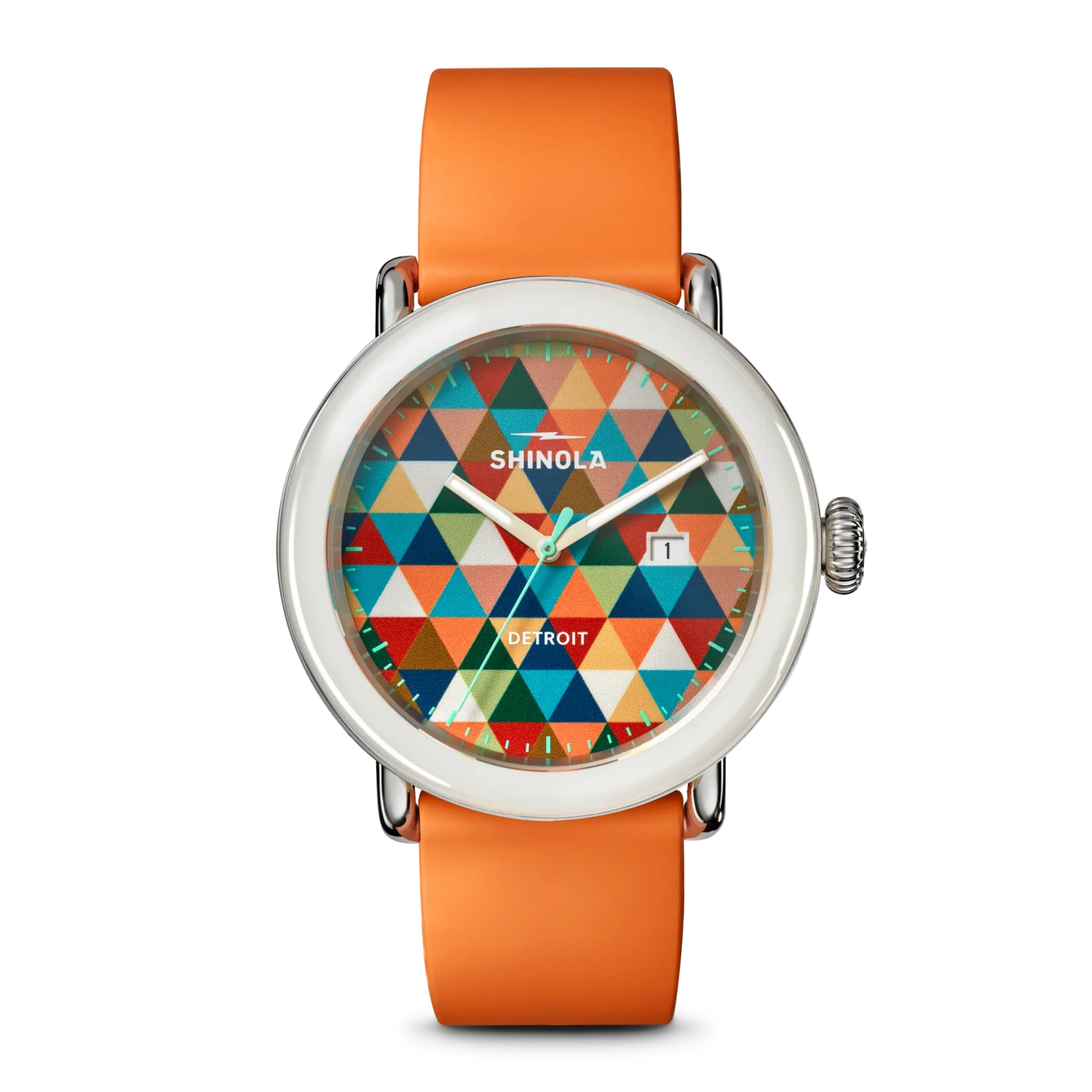 Shinola watch with silver case, orange rubber strap, and a vibrant geometric triangle dial with date window at 3 o'clock. Black background.