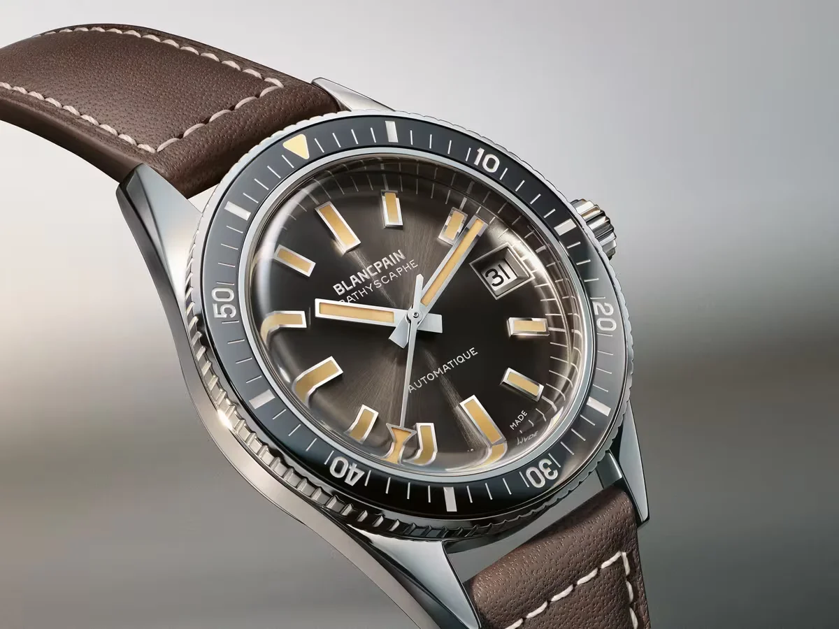 Blancpain Bathyscaphe diver's watch with dark grey dial, tan markers, date at 3, steel case, brown leather strap.