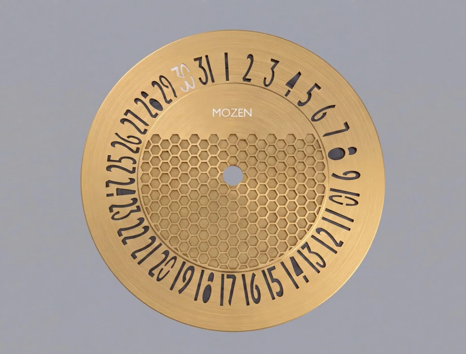 Golden watch date ring with cut-out numbers 1-29, white 30 & 31, honeycomb center, and MOZEN logo.