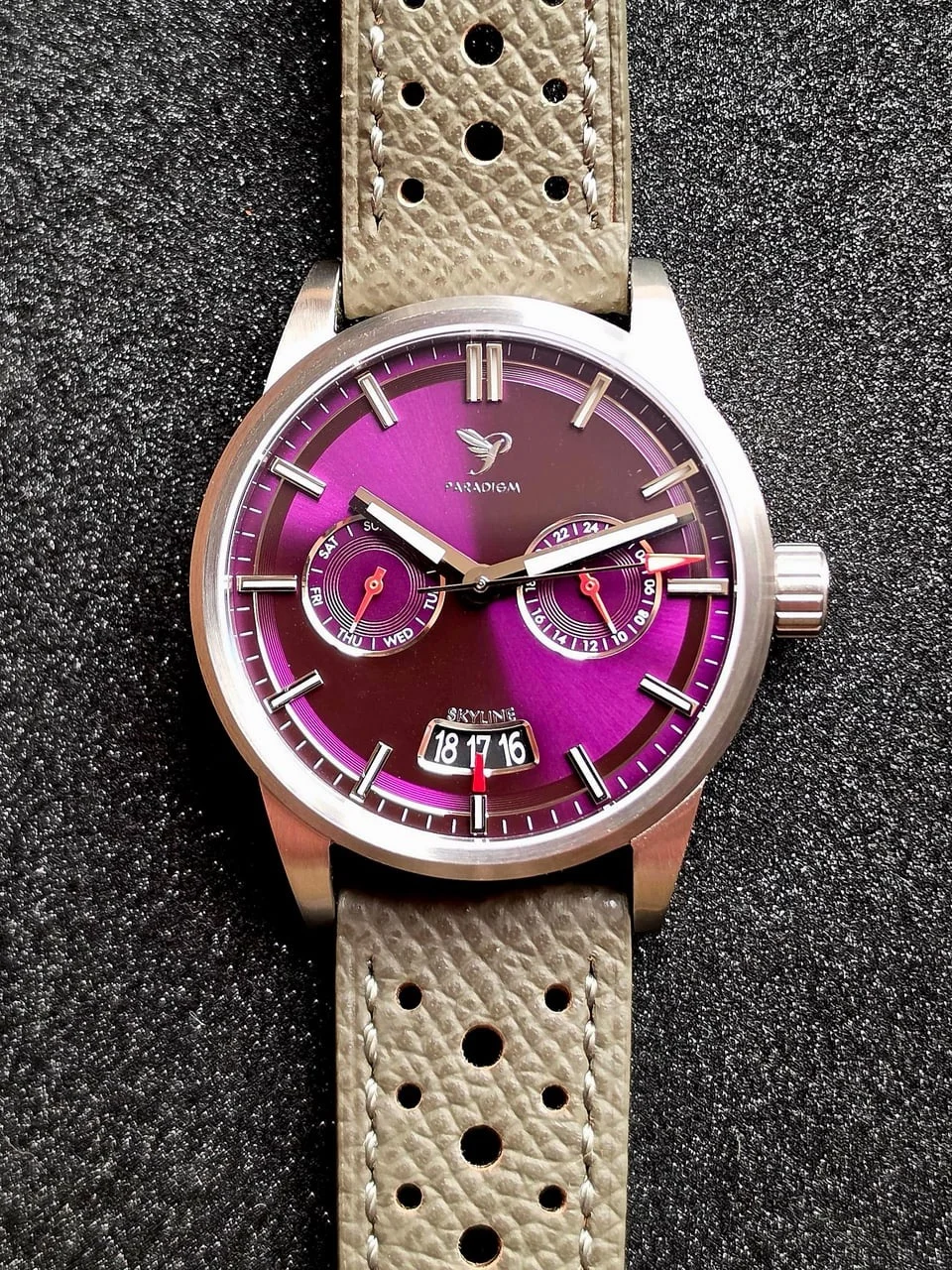 PARADIGM Skyline watch, purple gradient dial, day/24hr subdials, big date, grey perforated strap on textured black.