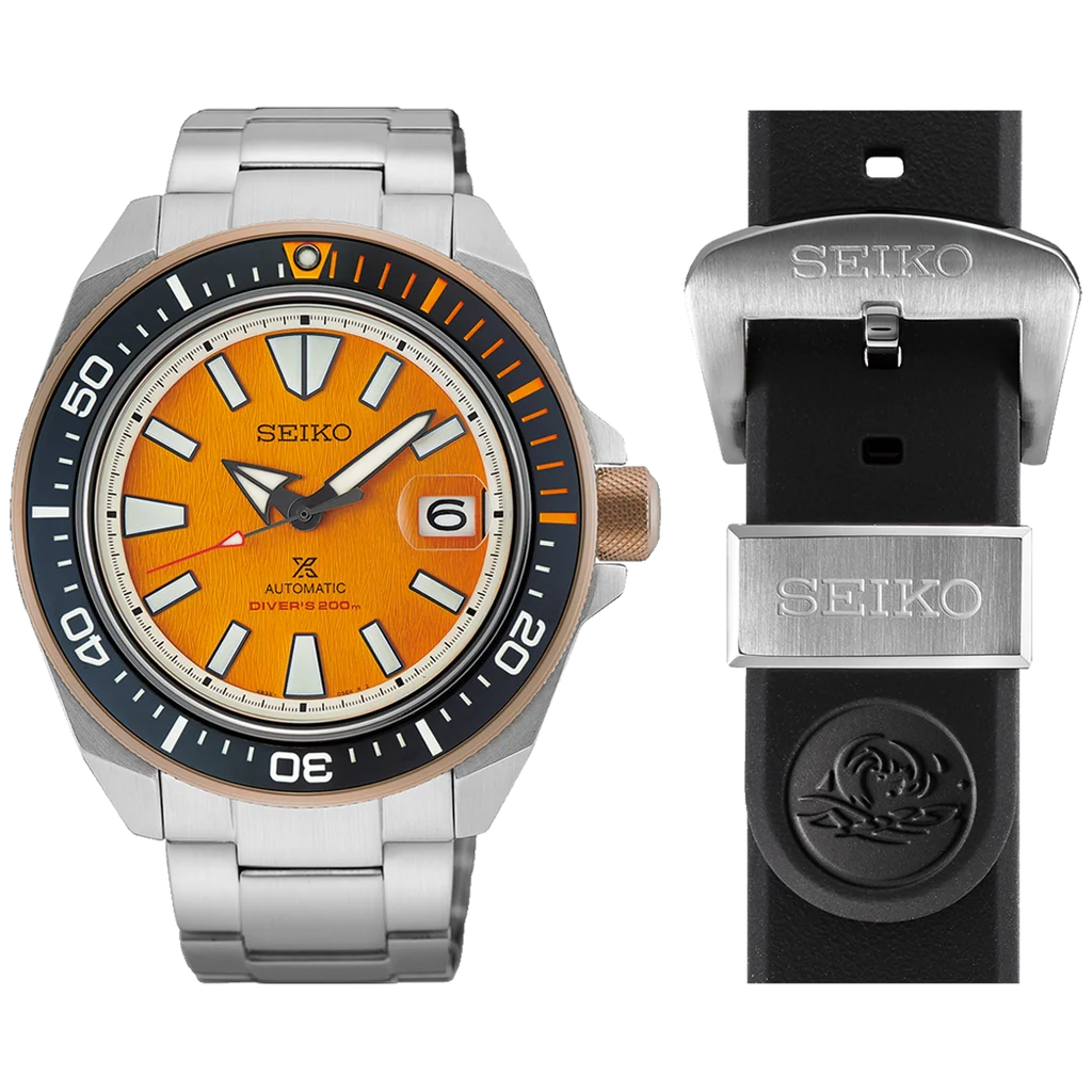 Seiko Prospex diver: orange dial, steel bracelet, black/orange bezel, bronze crown. Black rubber strap with Seiko buckle & diver logo.