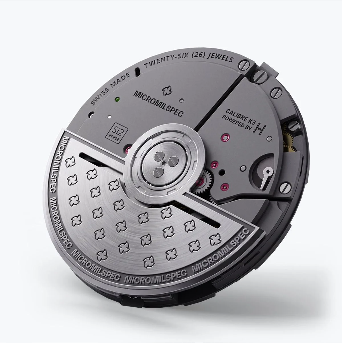 Grey Micromilspec Calibre K3 Swiss-made watch movement, 26 jewels, with a prominent rotor and visible gears.