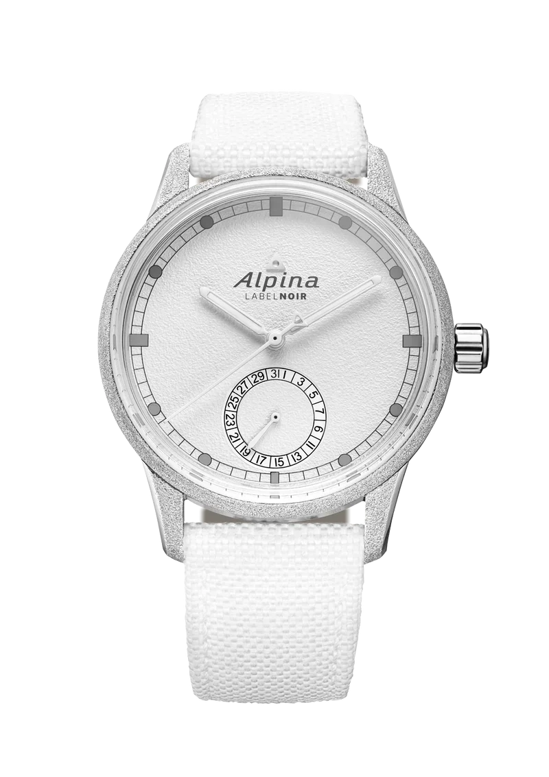 Close-up of Alpina LABELNOIR watch with textured white dial, frosted silver case, date sub-dial, and white canvas strap.
