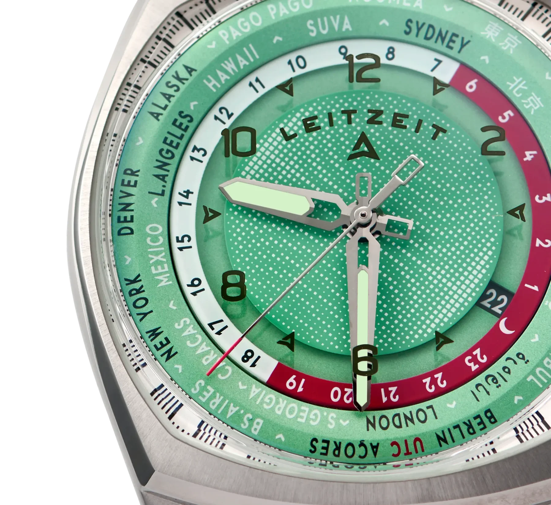 Close-up: Green Leitzeit world timer watch with luminous hands, dotted dial, city names, 24-hour ring, and brushed steel case.