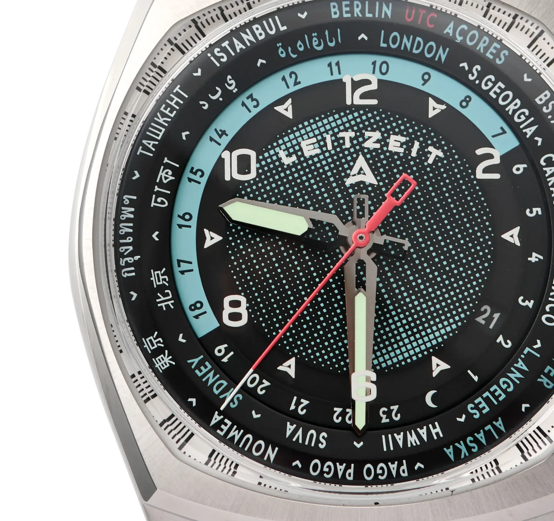 Close-up of a Leitzeit world timer luxury watch. Silver case, black dial with turquoise speckles, city names, 24-hour ring, red seconds hand.