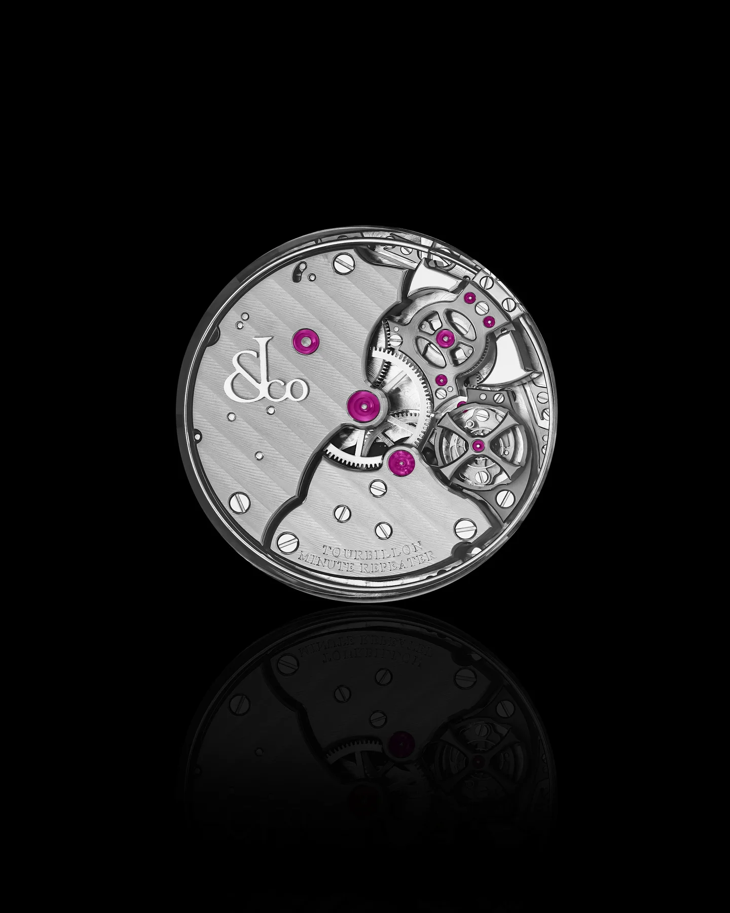 Silver J&Co watch movement with Geneva stripes, pink ruby jewels, exposed gears, Tourbillon Minute Repeater, on black with reflection.