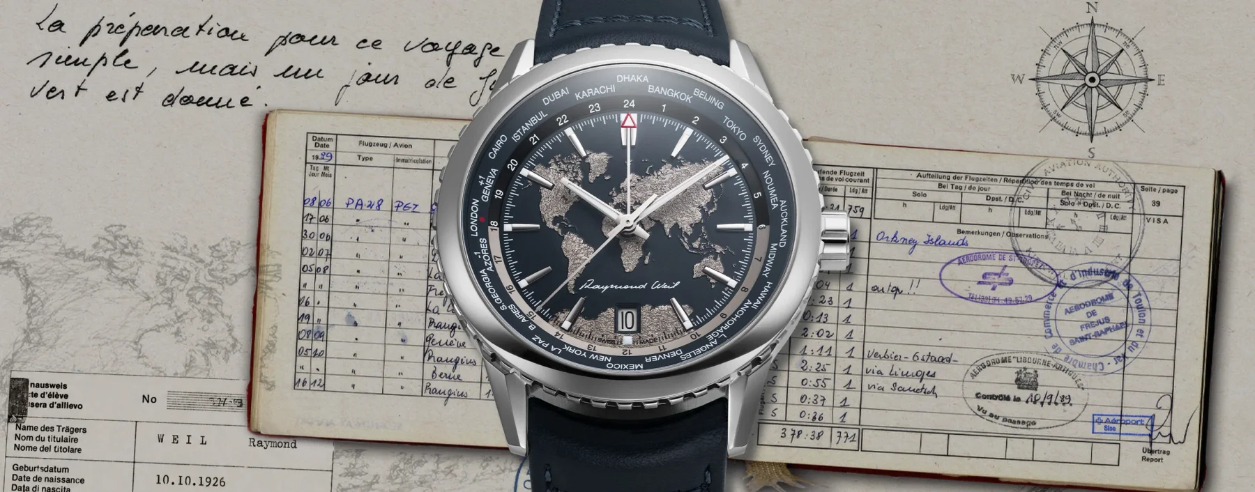 Raymond Weil steel world timer watch with blue strap, on vintage pilot documents with handwritten script and compass.