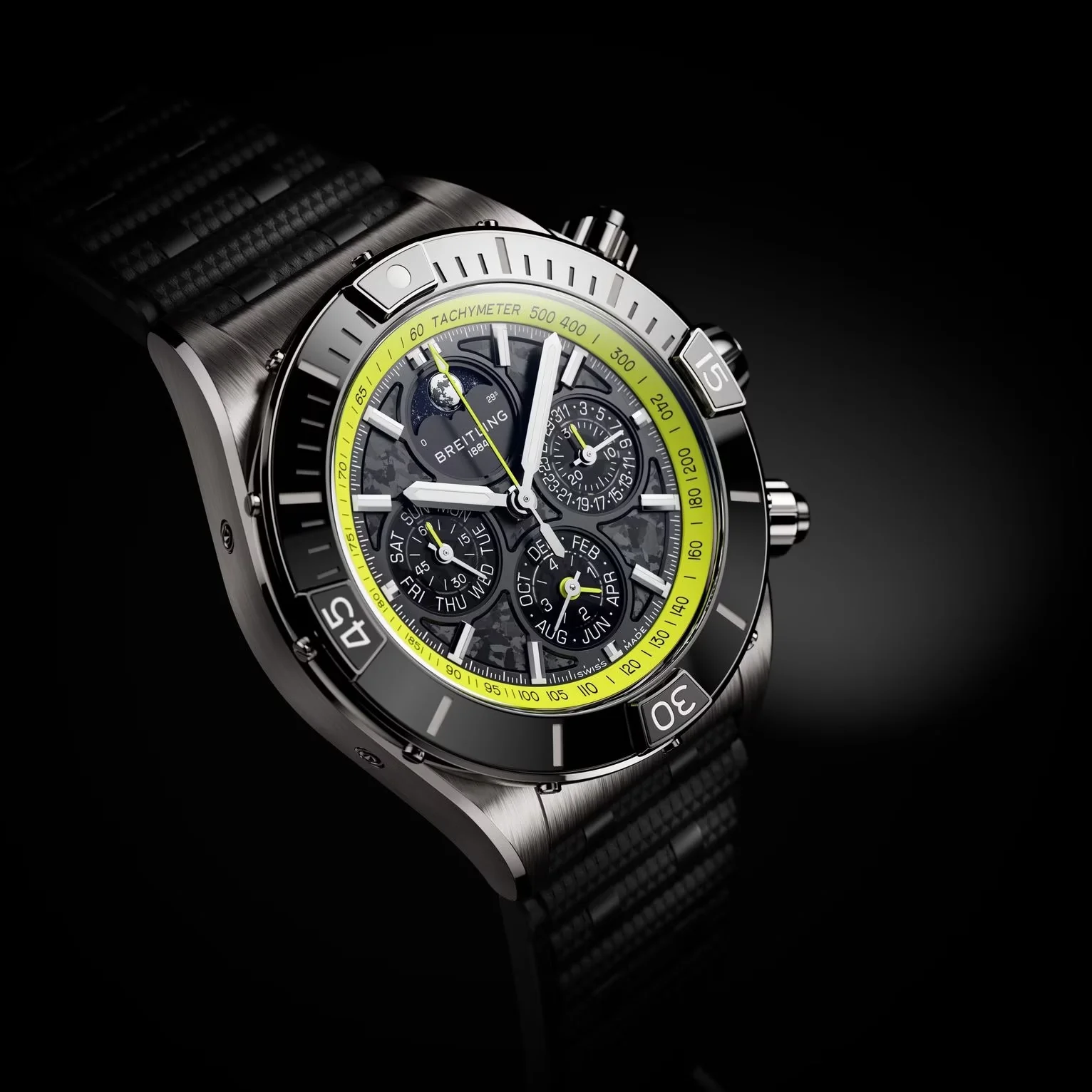 Breitling Chronomat with textured black dial, yellow tachymeter bezel, moon phase, and perpetual calendar on black.