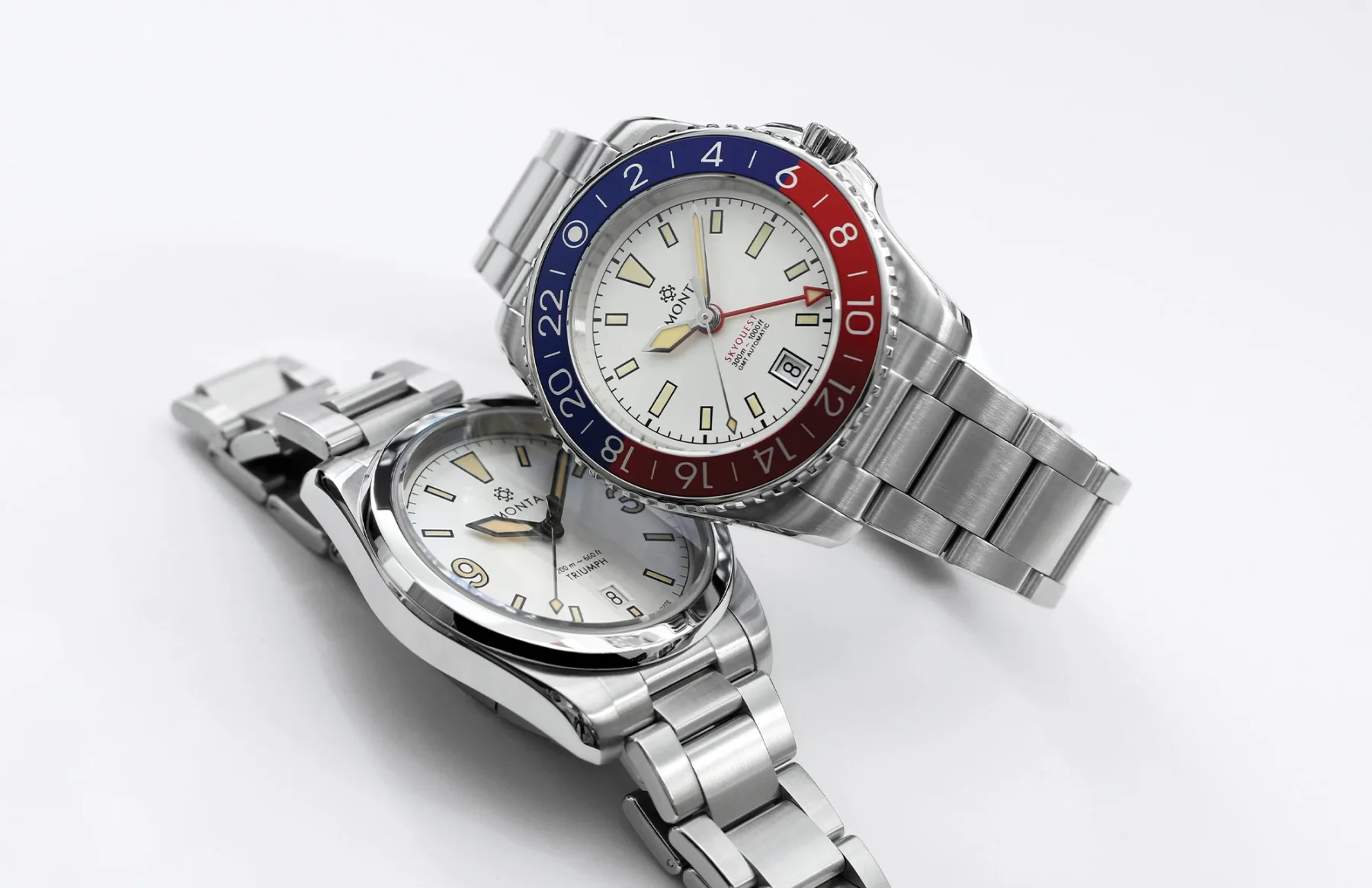Two Monta luxury watches on a white background. Top: Skyquest GMT with red/blue Pepsi bezel. Bottom: Triumph.