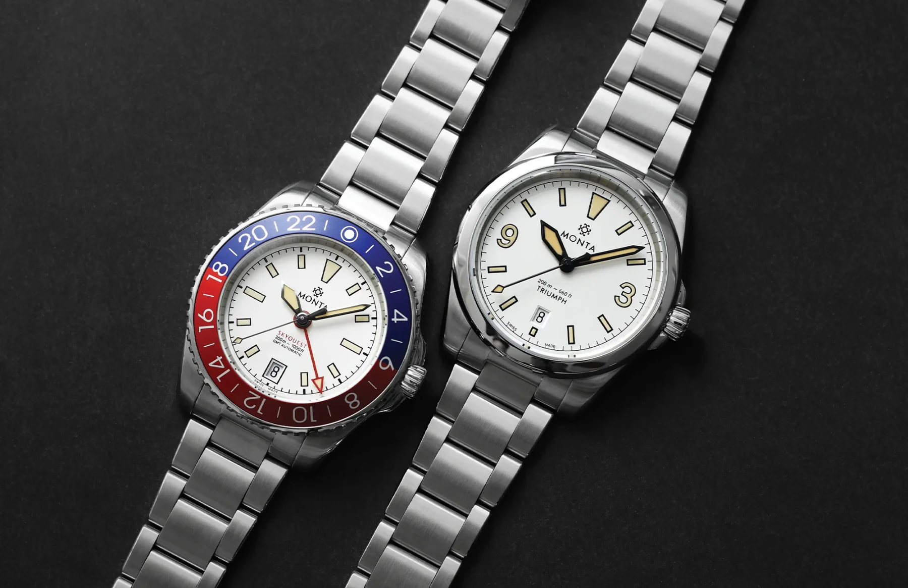 Two Monta watches. Left: Skyquest GMT, white dial, red/blue bezel. Right: Triumph, white dial, numeric 3-9-12. Dark surface.