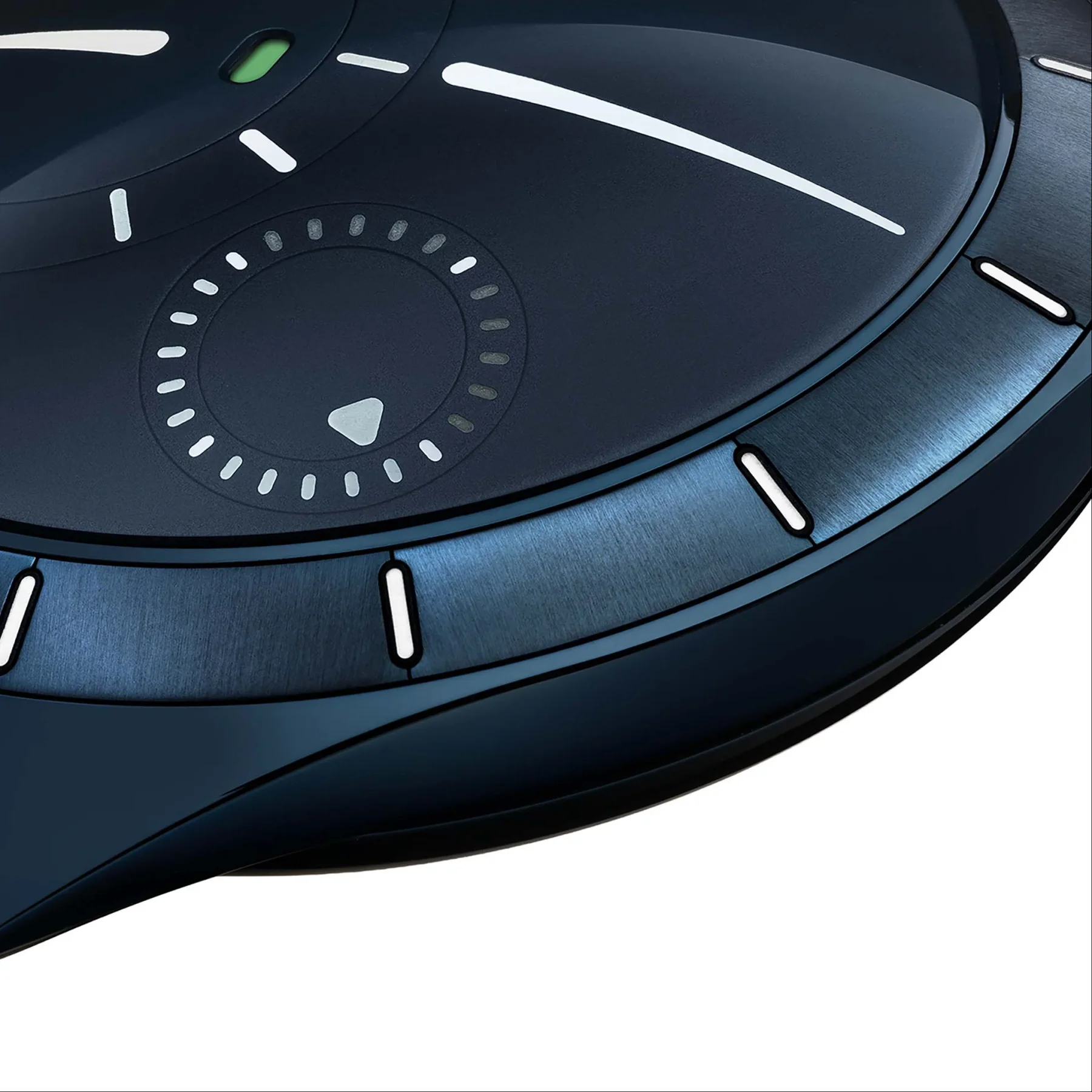 Close-up: dark blue luxury watch dial with white markers, wide indicator, green oval, and central dotted ring.