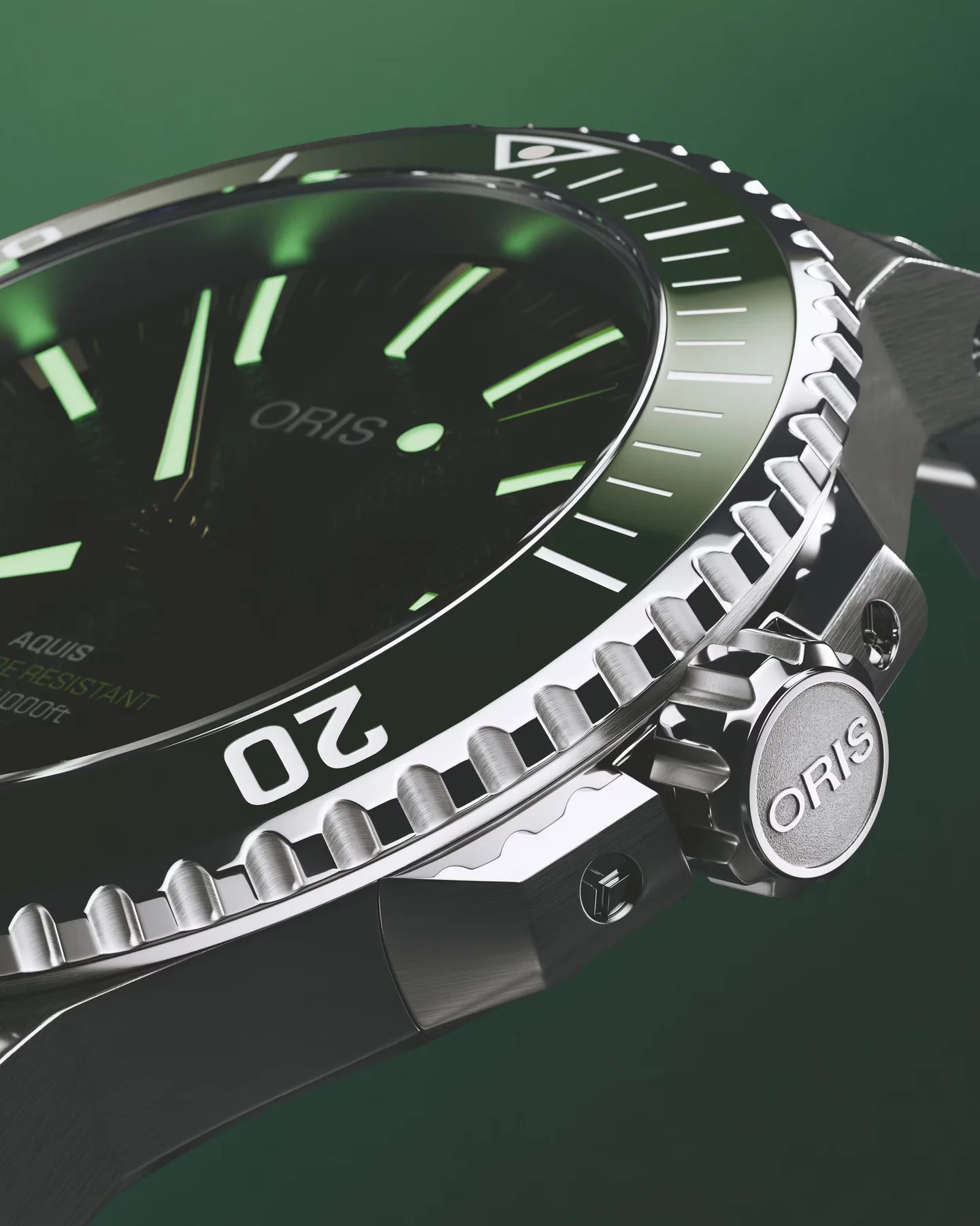 Oris Aquis dive watch close-up: dark green dial with glowing markers, textured bezel, and Oris logo on crown.