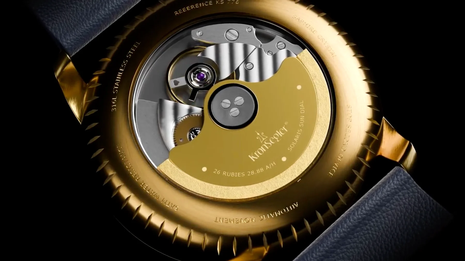 Gold KronSeegler watch case back, exposing its automatic movement, gold rotor, 26 jewels, and dark leather strap.