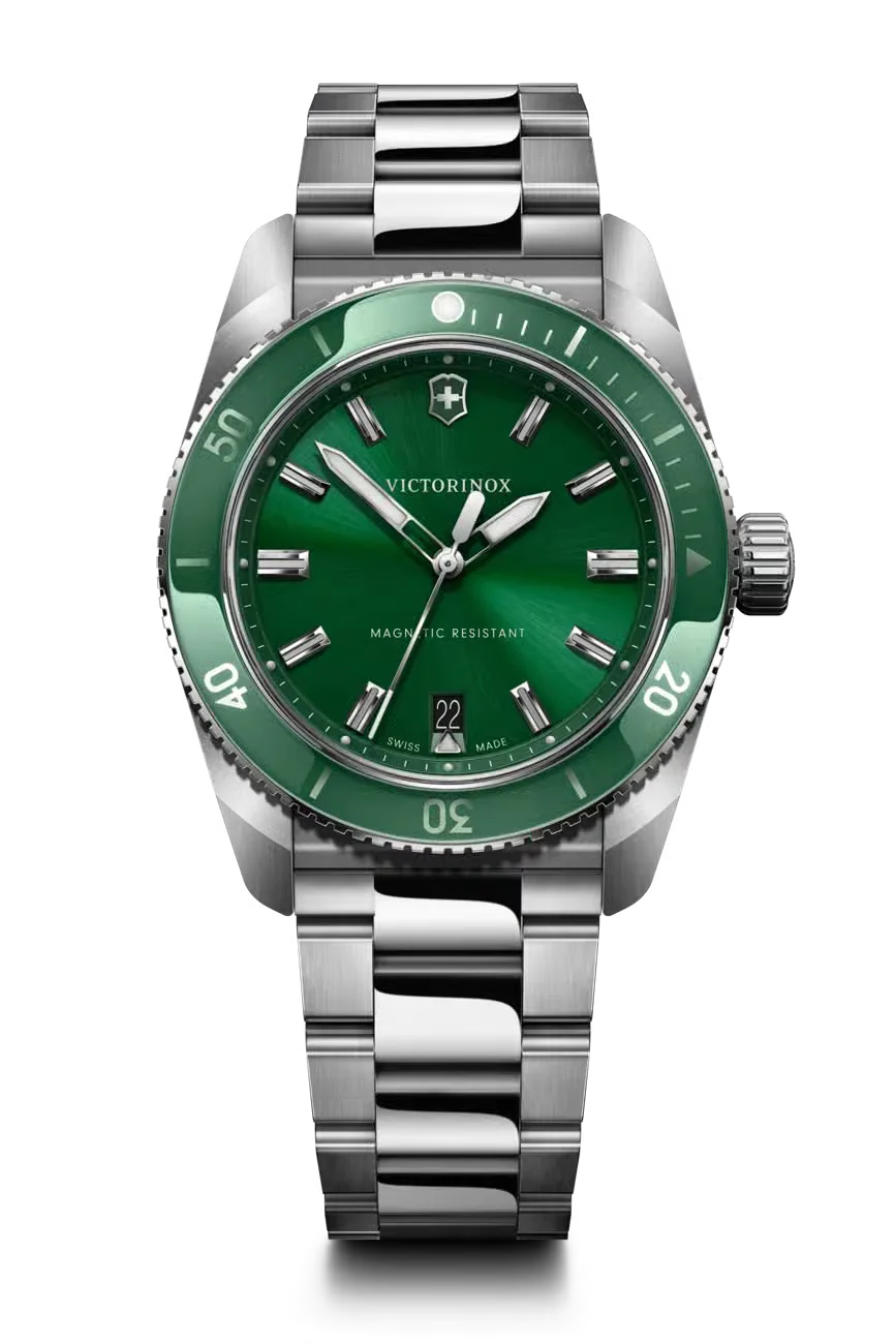Victorinox stainless steel dive watch with vibrant green sunray dial, green unidirectional bezel, and date 22.
