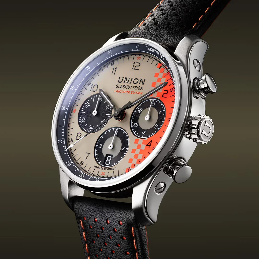 Union Glashütte/SA. limited edition chronograph: silver case, cream dial, orange checkered pattern, black sub-dials, perforated leather strap.