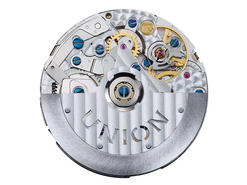 Close-up of a decorated automatic watch movement, with gold gears, blued screws, ruby jewels, and a "UNION" rotor.
