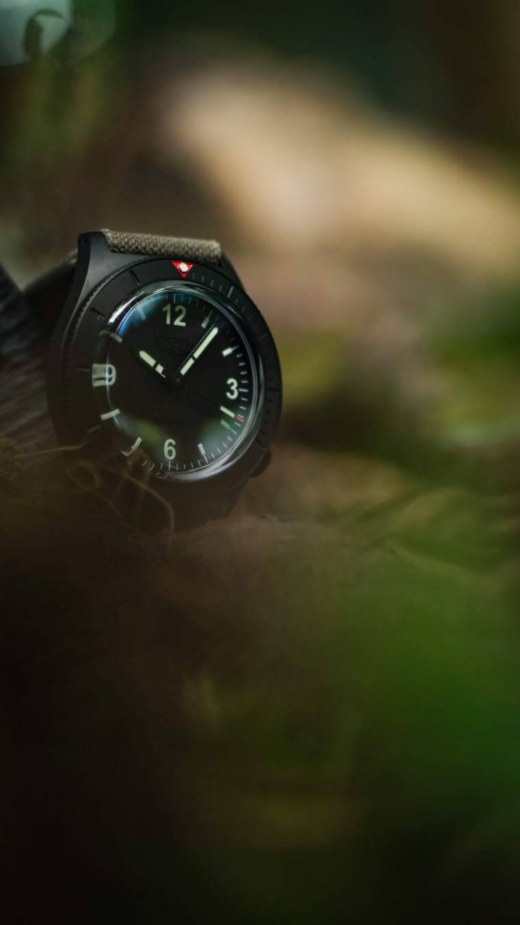 The Greg Stevens Design (GSD) 5 Series stands out as a masterclass in affordable beater grab and go watches, defined heavily by its signature, tall domed sapphire crystal that bridges vintage military aesthetics with modern beater utility. Known as an ultimate “workshop piece,” this microbrand diver trades delicate luxury gimmicks for pure beater resilience.

While massive luxury houses build watches meant for safe deposit boxes, Greg Stevens built the 5 Series to get dirty.

The Stature: The watch spans 42mm across and 50mm lug-to-lug, packing a commanding wrist presence.

The Silhouette: It rests at 12mm thick, but pops up to 12.8mm overall once you account for that gorgeous, optical-distortion-inducing domed sapphire crystal.

The Comfort: A fluted screw-down crown is intentionally tucked away at the 4 o’clock position, ensuring it never bites into the back of your hand when you’re working.

The “Box” Crystal MagicThe true soul of the GSD 5 Series lives right on the surface. Stevens chosen a tall, beautifully sculpted domed sapphire crystal. It yields the edge-distortion and warm vintage character of a 1960s acrylic “box” crystal but brings the 100% scratch-proof armor of modern sapphire. Look at it dead-on, and the dial is laser-sharp. Angle your wrist, and the crystal catches the light, creating a gorgeous “flecto” that watch collectors live for. I would love a plexi crystal option because of how plexi ages so damn well. 

The “Ghost” Dial & Low-Light PowerThe dial leans heavily into functional minimalism. It utilizes a sterile, high-contrast cardinal layout that focuses on immediate spatial recognition.

The branding is completely “ghosted”—the GSD logo is subtly embossed directly onto the matte black surface. Under direct light, it looks like a clean, military-issued sterile dial; tilt it, and the reflective branding peeks through. When the sun drops, the hands and markers blaze to life courtesy of heavy layers of premium Superluminova.