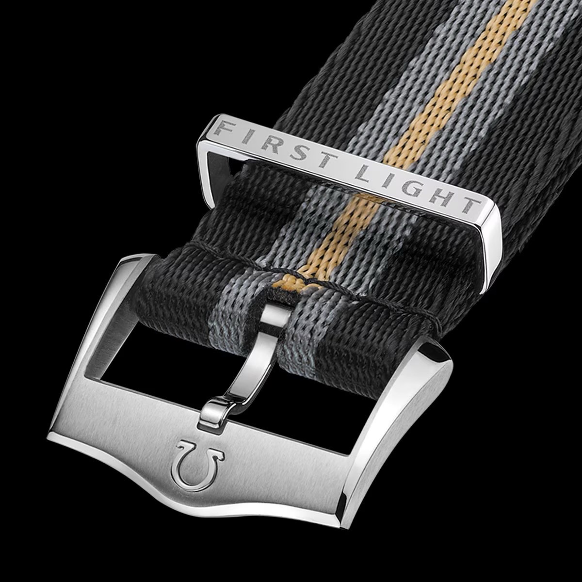 Black, grey, & gold striped NATO watch strap with a silver metal keeper engraved "FIRST LIGHT" & Omega logo buckle.