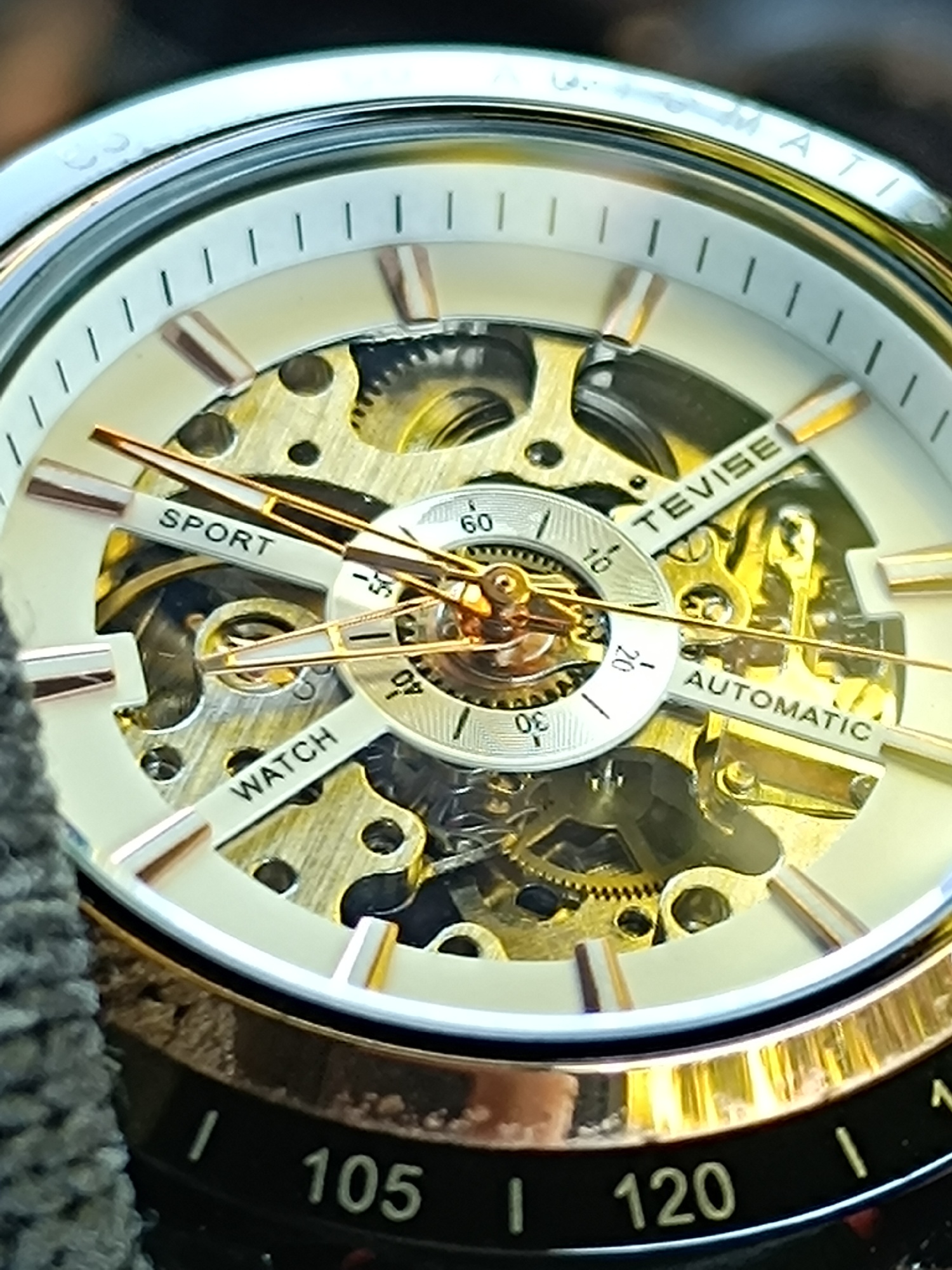 Tevise No. 868 Automatic. This watch is a great conversation starter with its skeleton dial, allowing you to see the intricate automatic mechanical movement in action. It's a fantastic entry-level watch for anyone looking to get into the world of mechanical timepieces without breaking the bank. The black and silver case with the red-stitched leather strap gives it a bold and sporty look, perfect for a casual day.
Watch Specs:
* Brand: Tevise
* Model: No. 868 (or T868)
* Movement: Automatic mechanical
* Case Material: Alloy/Stainless Steel
* Case Diameter: Approx. 43-44mm
* Case Thickness: Approx. 13mm
* Dial: Skeleton with luminous hands
* Crystal: Mineral glass
* Strap: Black leather with red stitching
* Water Resistance: 30 meters (3 ATM) - suitable for daily wear, not for swimming or showering.