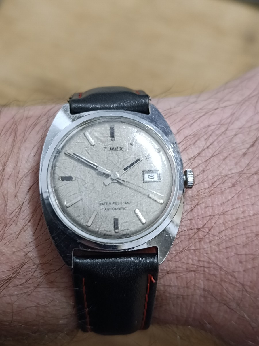Today is Day 131, and I’m featuring this vintage Timex Automatic, a true survivor from the golden age of mechanical timepieces.
This classic Timex embodies rugged reliability and timeless simplicity — with its silver sunburst dial, date complication at 3 o’clock, and automatic movement that still runs strong decades later.
Whether you’re a watch enthusiast, a vintage collector, or just love mechanical craftsmanship, this piece reminds us that durability and charm never go out of style.
🕰️ Specs (AI-Estimated):
Brand: Timex
Model: Vintage Timex Automatic (1970s era)
Movement: 21-Jewel Automatic
Case: Stainless Steel, 36mm
Dial: Aged Silver Textured Finish
Crystal: Acrylic Domed
Water Resistance: Splash Resistant
Strap: Black Leather with Red Stitching
💬 What do you think about vintage Timex watches? Would you add one to your collection? Comment below!