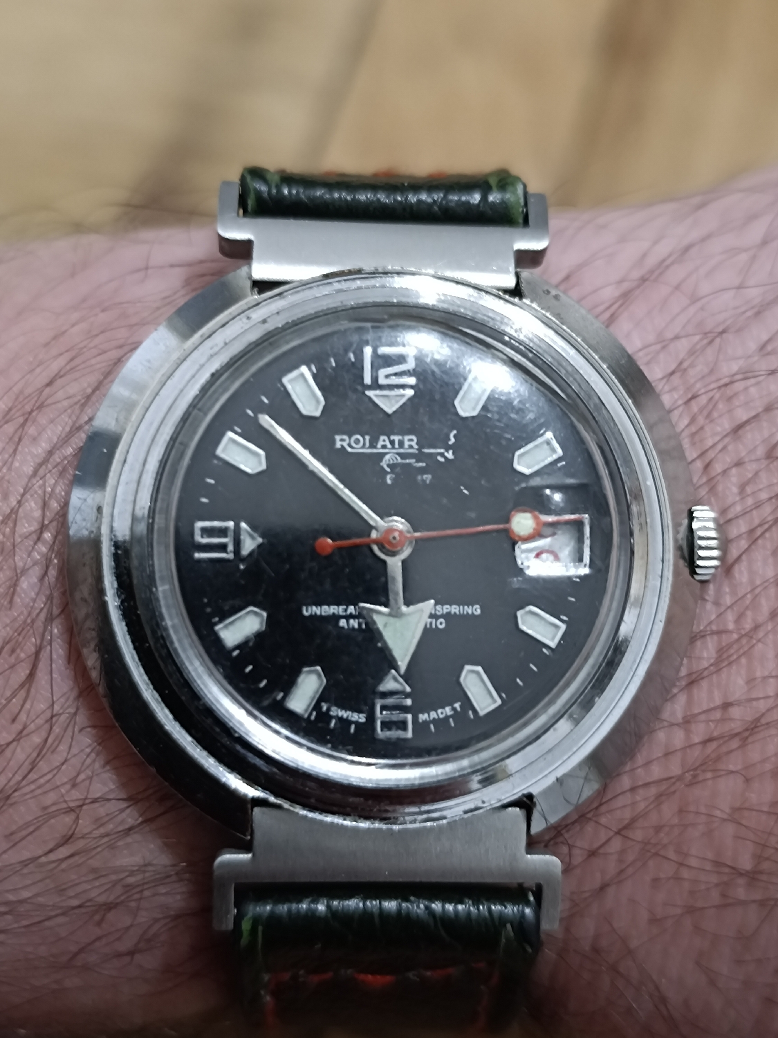 Rolatron Super 27
Anti-magnetic
Unbreakable Main Spring
Swiss Made
This watch is really strange. It looks like a spaceship and I like it. Some call it UFO. It uses a simple 866 with date (which complicates things) movement.
I can't find info about it though.
BFG 866 is one of the most commonly