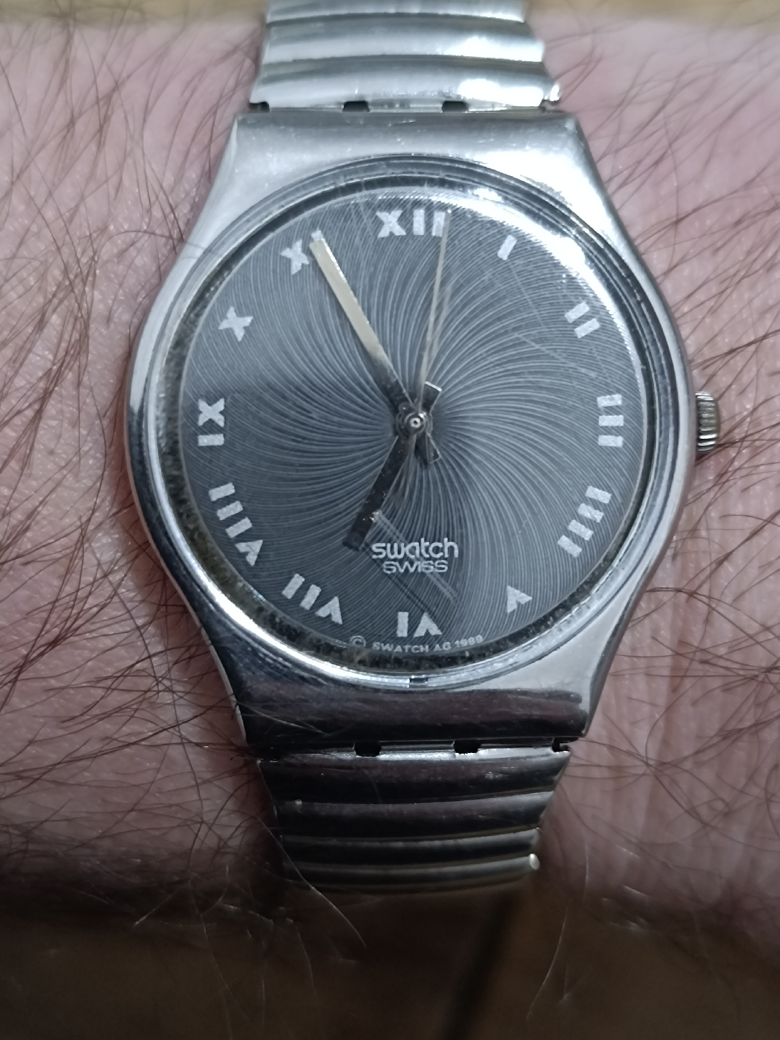 A vintage 1989 Swatch watch Iron man GY116/GY117 on a flex strap. I remember wanting one of these as a kid but we were very poor and I couldn't have it. I'm still poor but now I'm a grown up kid that wants to have everything he couldn't when he was a kid. 
