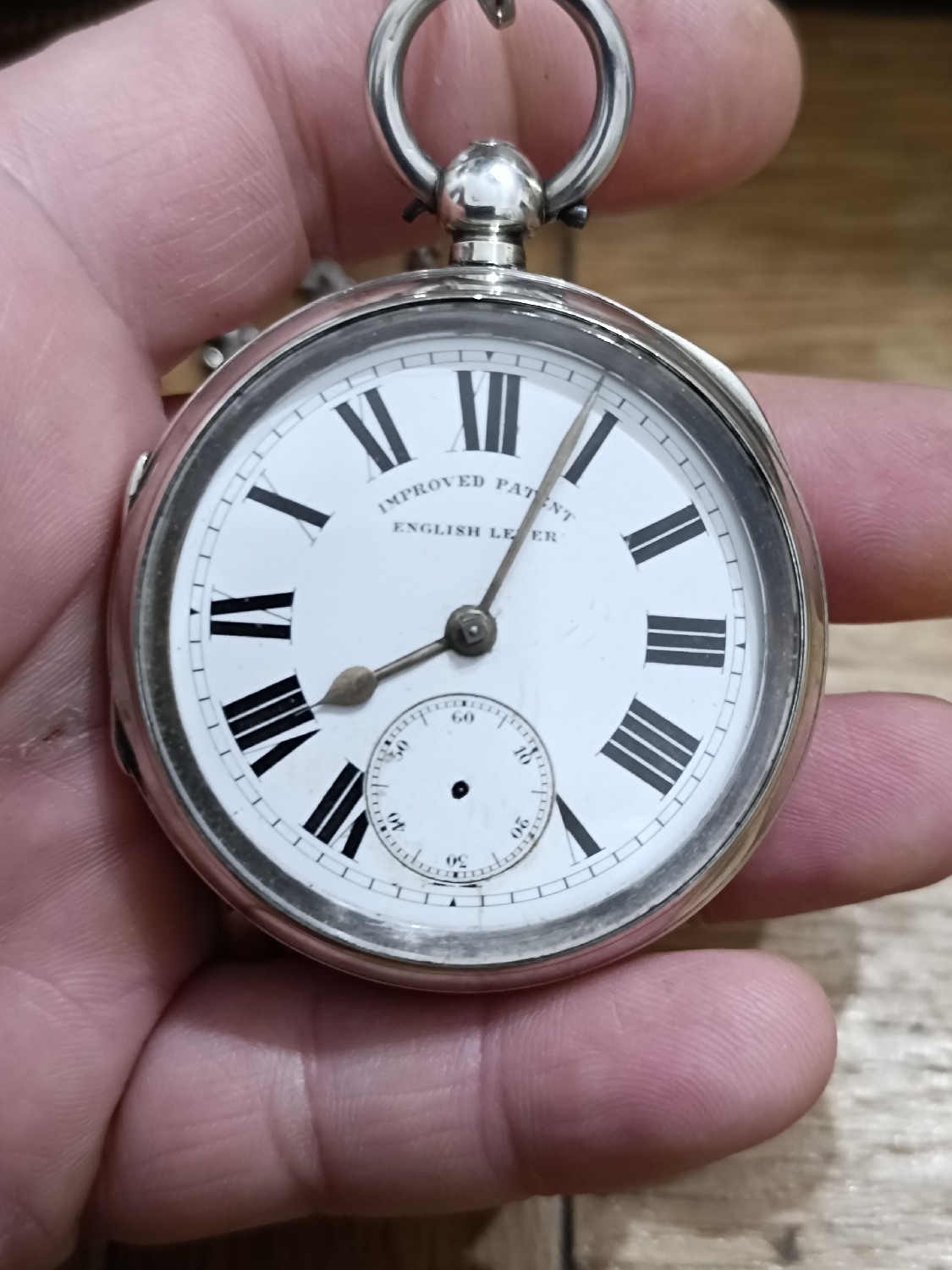 This is a 1892 hallmarked Silver pocket watch by The Lancashire Watch Co. Watchmaker Thomas Peter Hewitt 
Of course, if my research is correct however I'm no specialist in this area. 
Unfortunately it's missing the second hand but nevertheless it's absolutely beautiful. 
