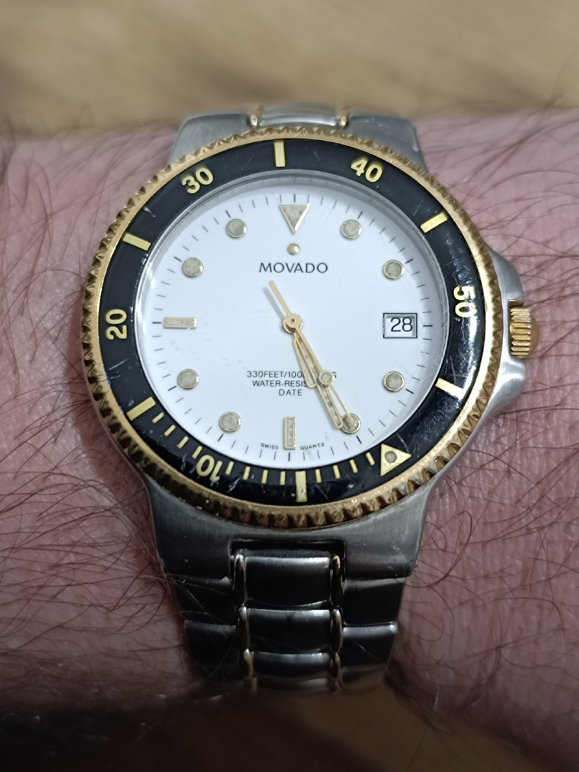Movado Sports Edition - This crosses the pond from a special friend. 
100m wr, Swiss Quartz, Rotating bezel, divers case with screw down crown, date window by 3