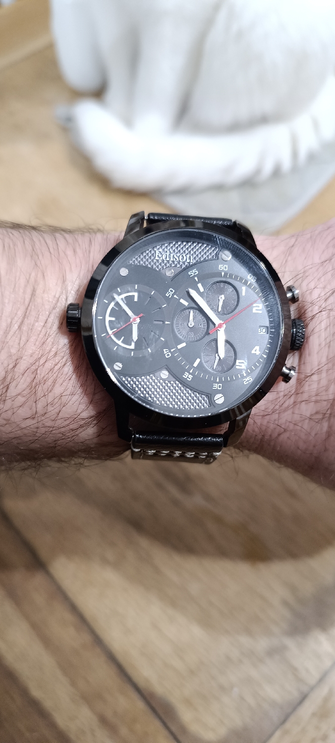It's gigantic but extremely comfortable to wear.  It's DualTime but a shite quartz movement inside. The chronograph actually works, even more impressive. The design, I actually like it very much. 