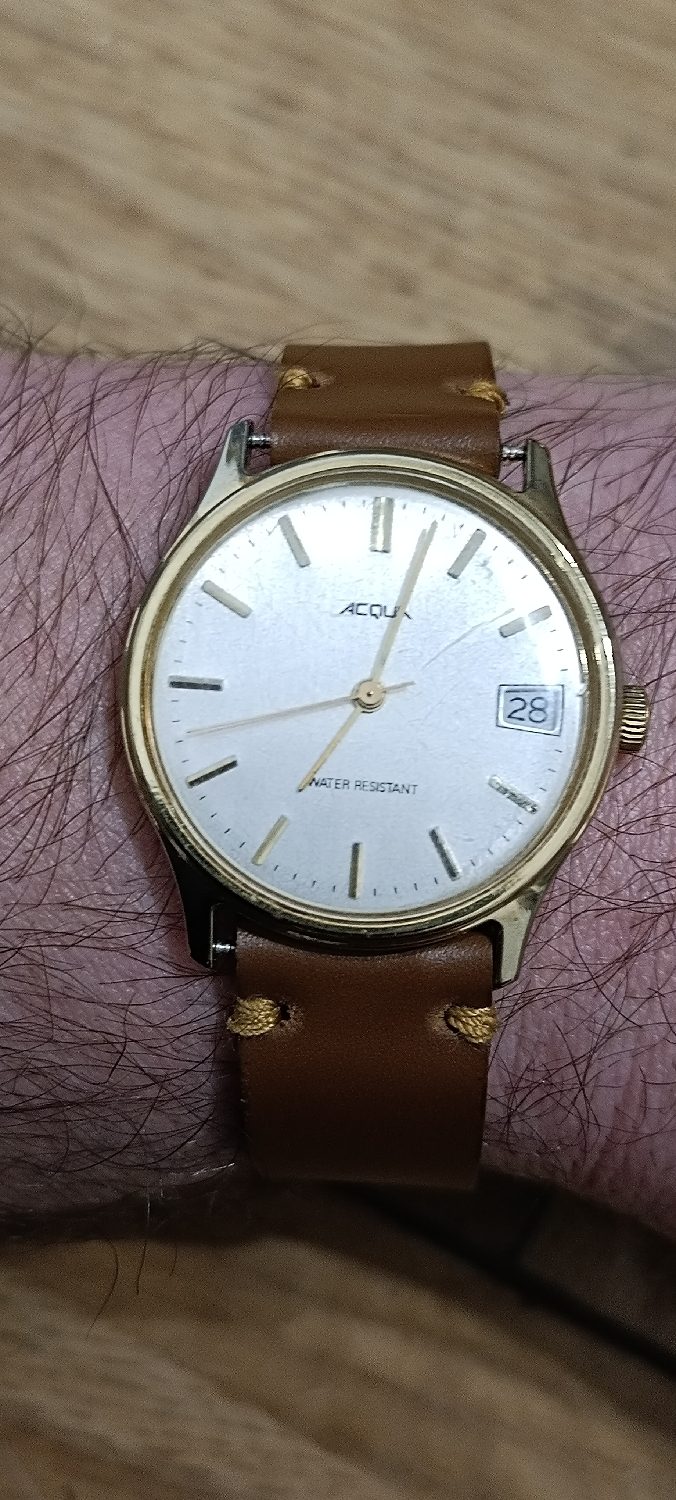 Vintage Acqua by Timex
Mechanical hand winding 
Yeah, I definitely need to change that strap. 
