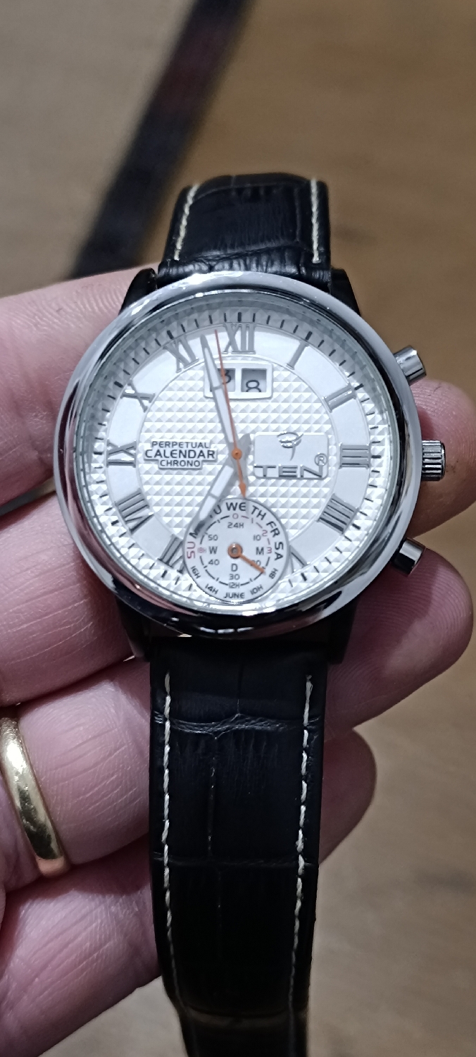 Million dollar baby!? Nah. Probably a tenner. I don't have a clue what kind of watch is this?
It's a quartz movement inside with a really complicated movement. Requires two batteries to operate and to access the second battery you have to perform a partial movement disassemble.
