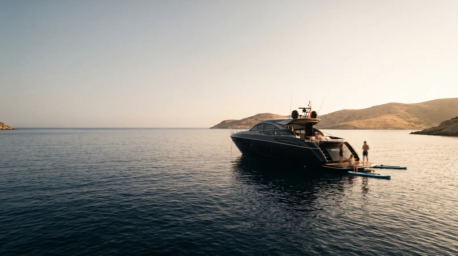 Team activities beside an anchored yacht