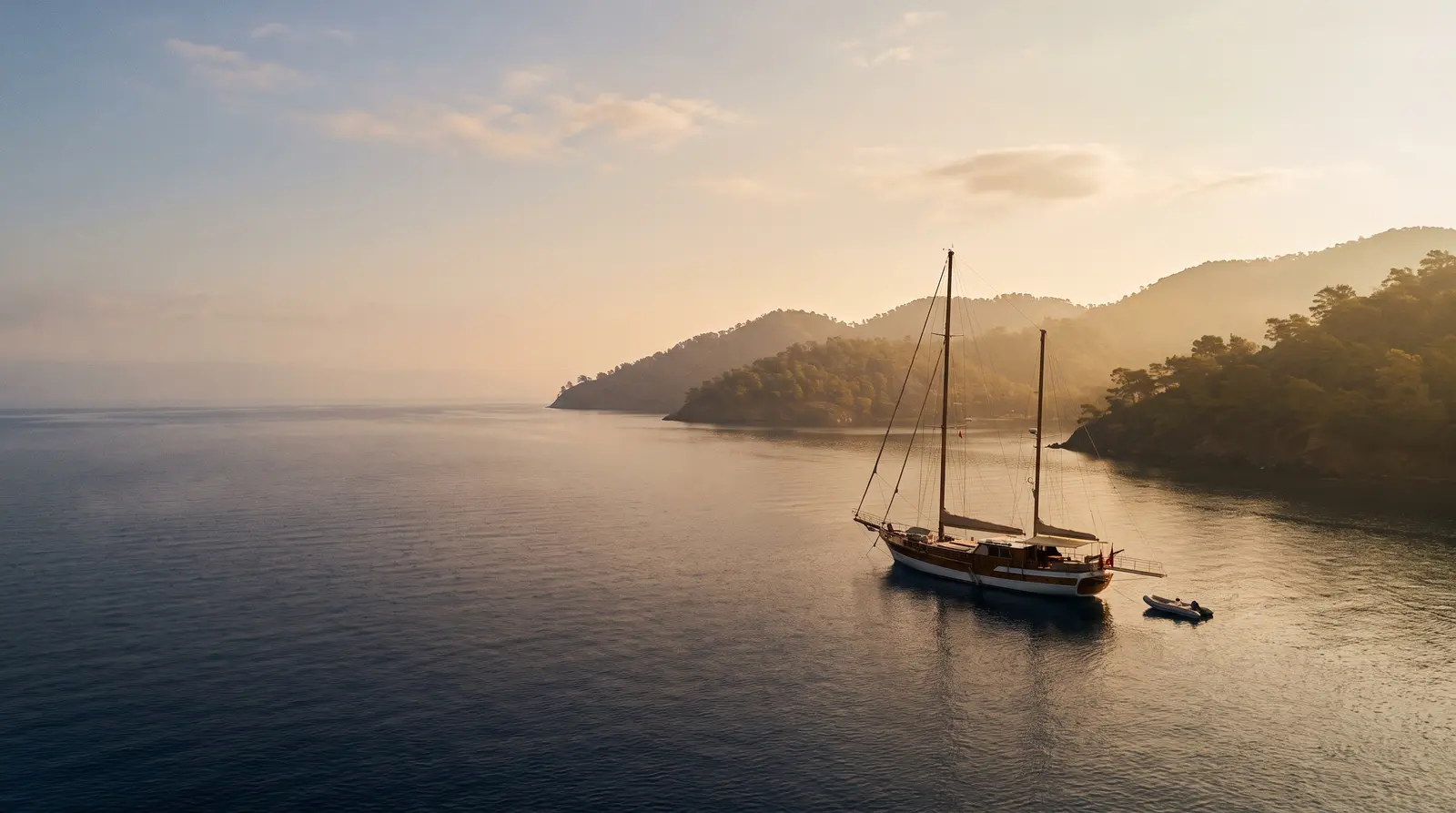 Sailing yacht at anchor at dawn