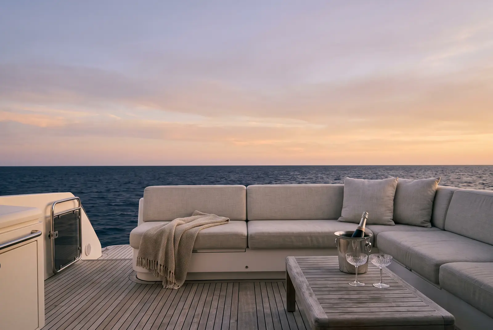 Aft deck of a luxury yacht set for sunset drinks