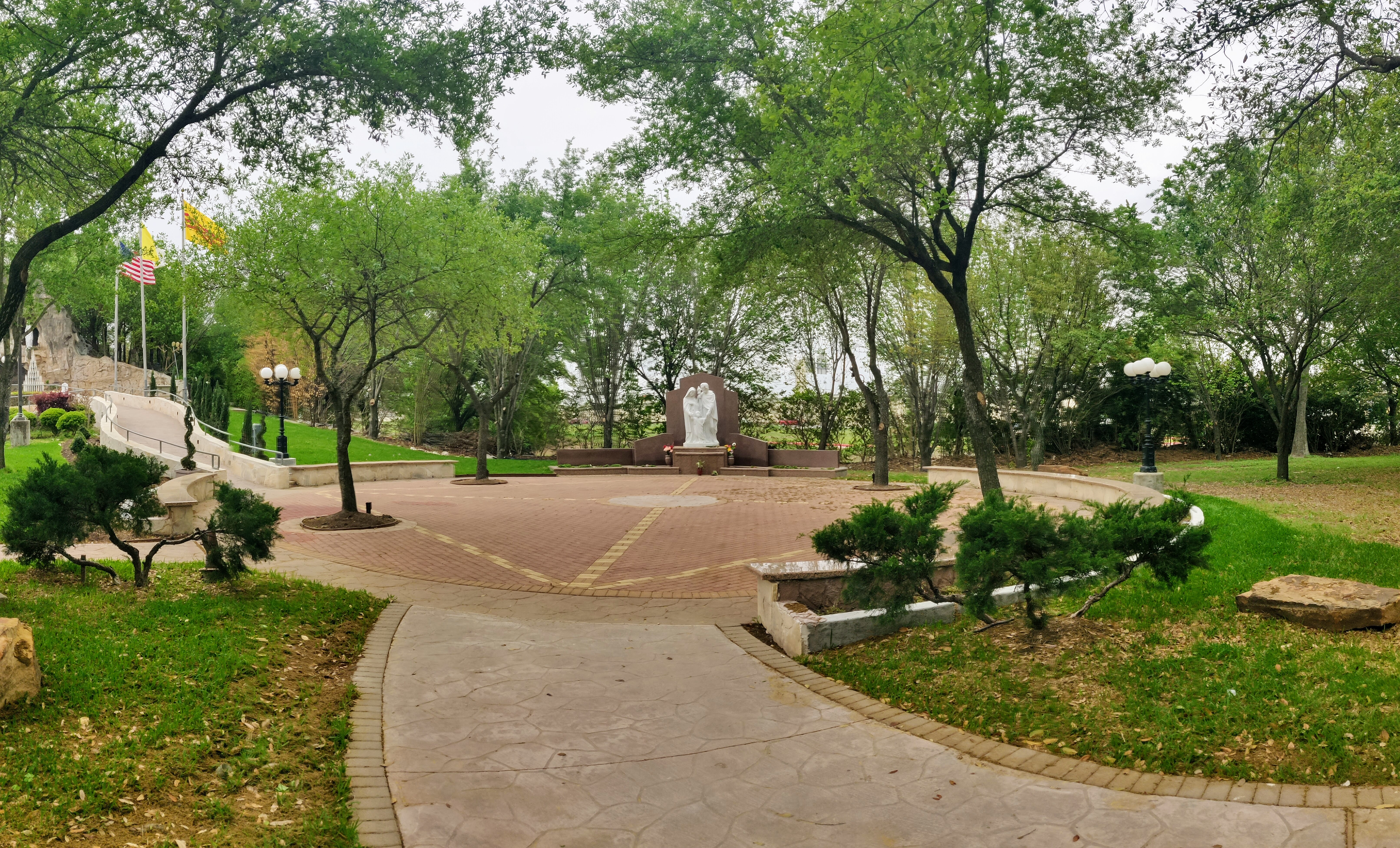 Newly constructed concrete walkways and small plaza area