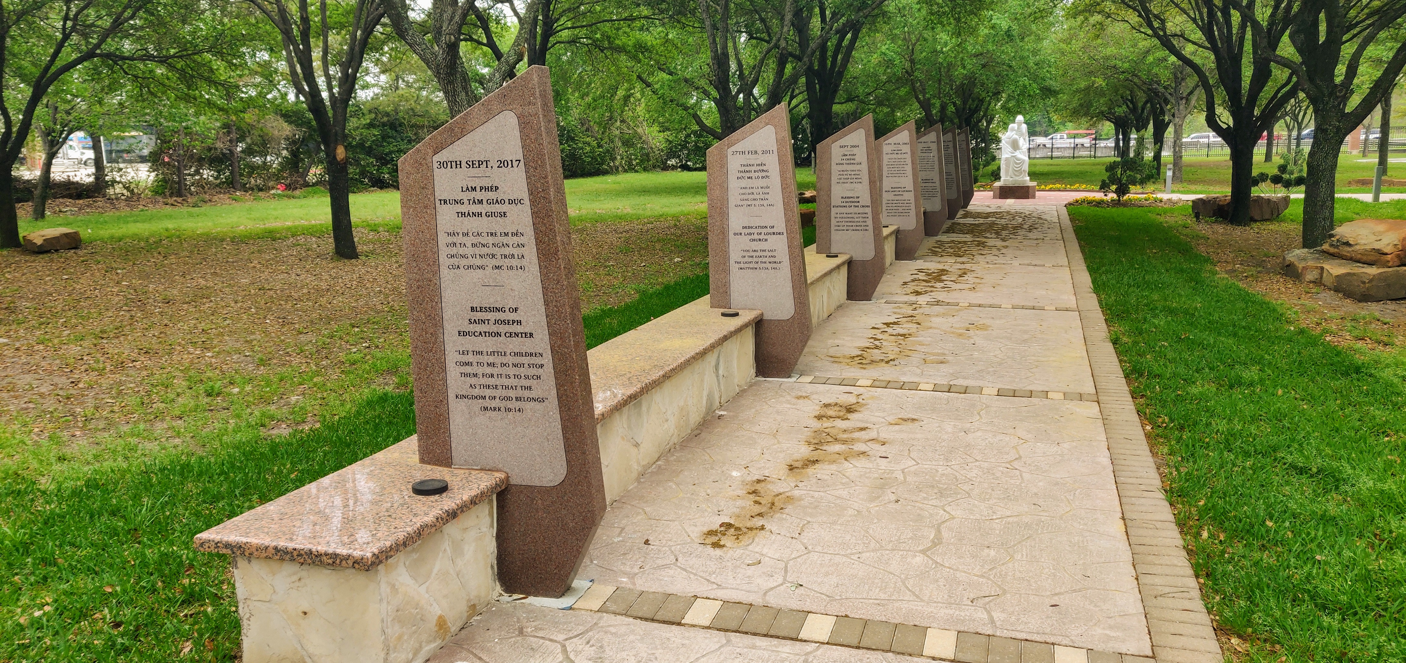 Newly constructed walkway with benches and commemorative plaques