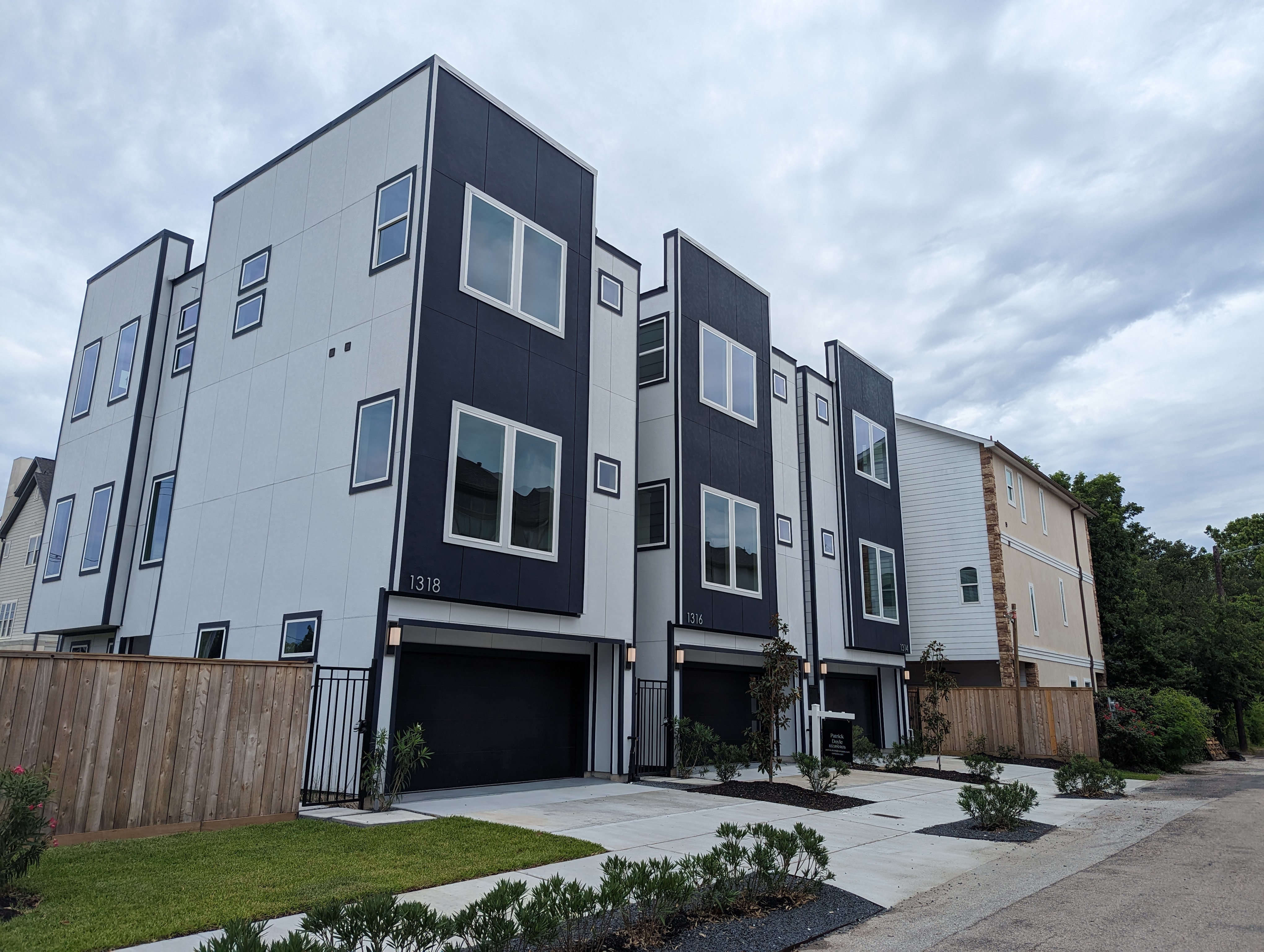 Street view of modern townhome style single family house