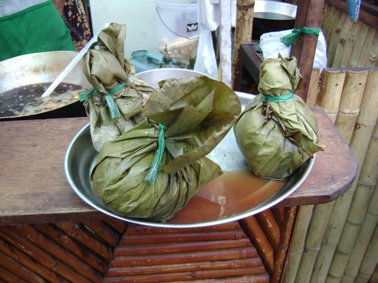 Juanes wrapped in bijao leaves and tied, ready to be served
