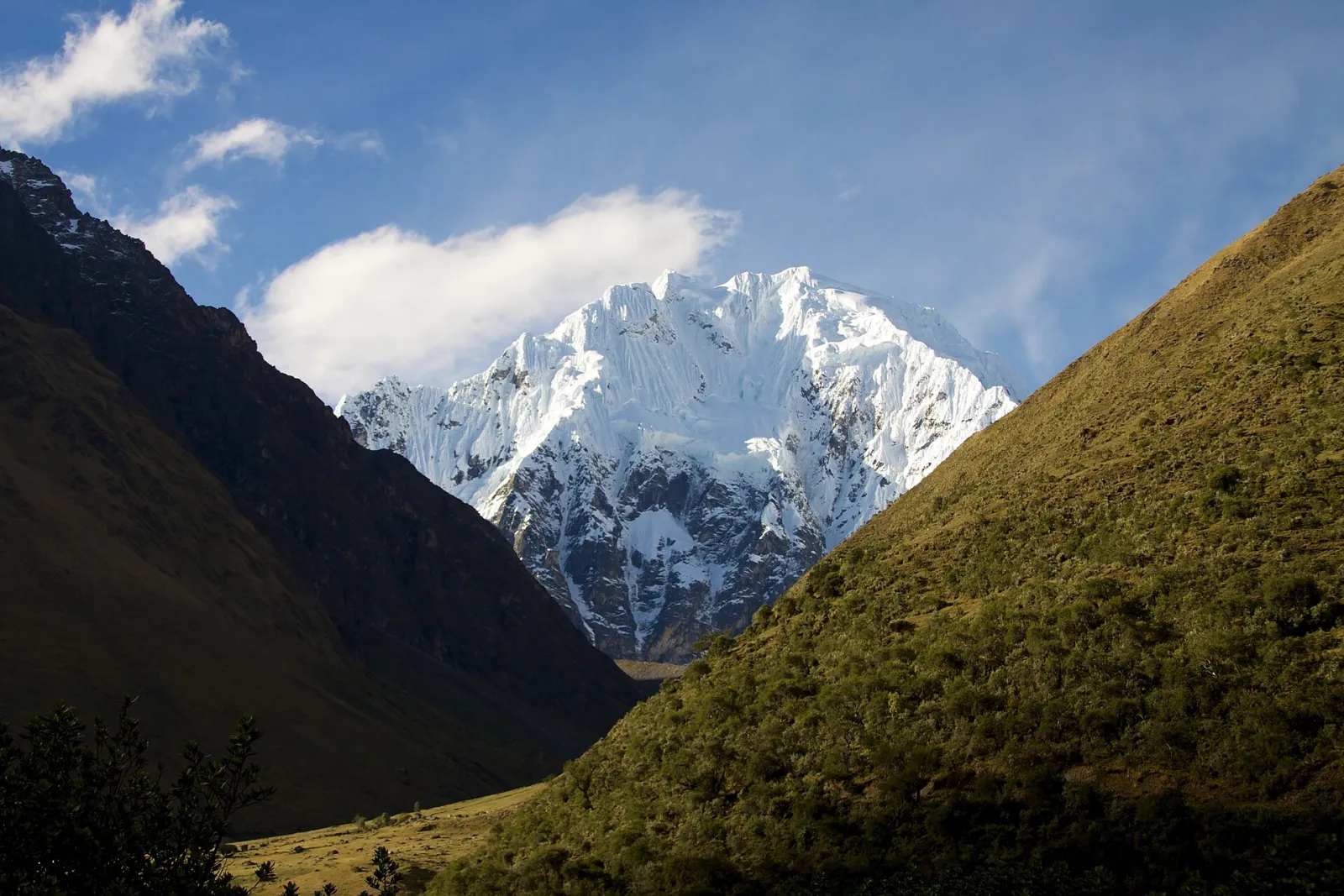 Nevado Salkantay covered in ice above a green valley near Soraypampa