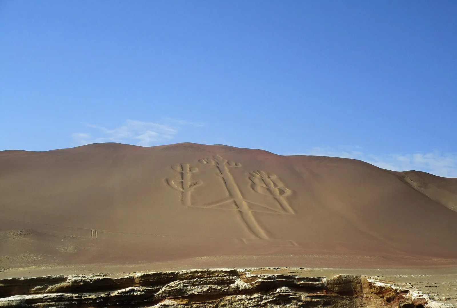 The Paracas Candelabra geoglyph carved into a sand hill above the sea