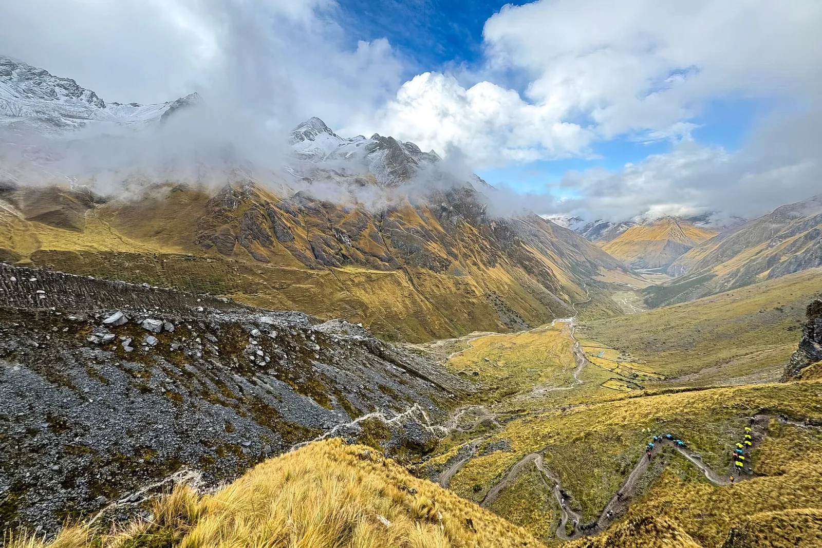 Switchback trail climbing toward the Salkantay Pass with glaciers above the valley