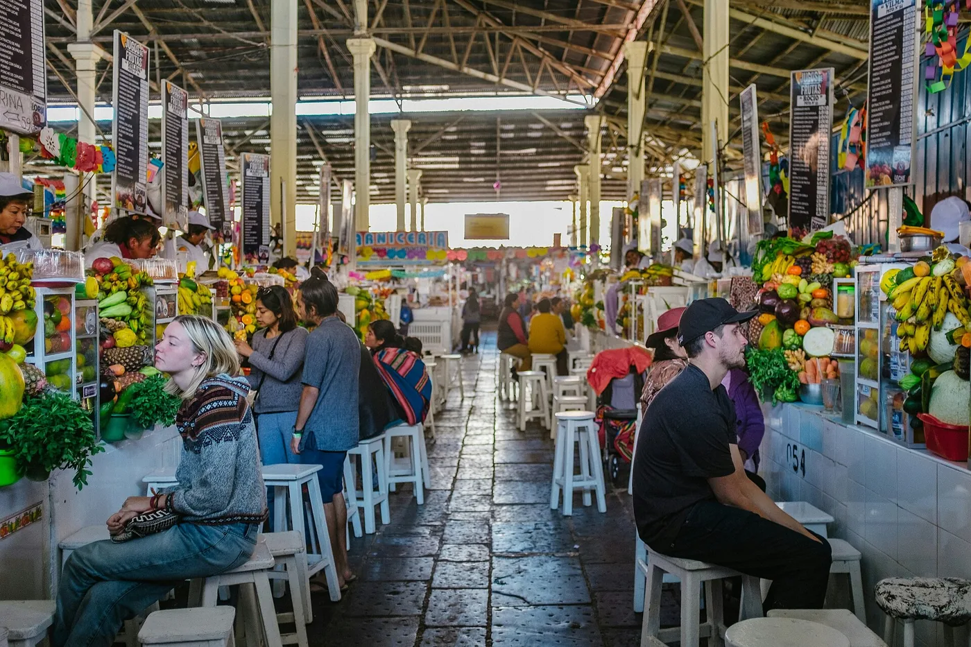 Fruit and juice stalls inside San Pedro market in Cusco