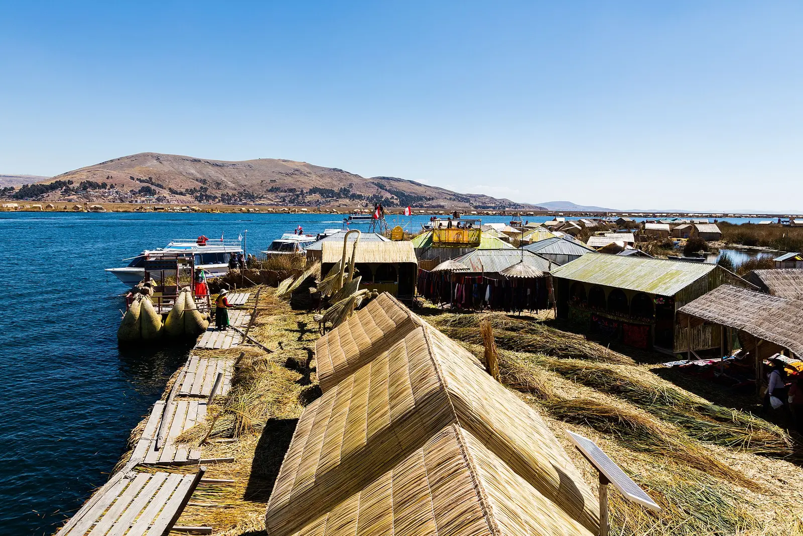 Reed boats and houses on one of the Uros floating islands of Lake Titicaca