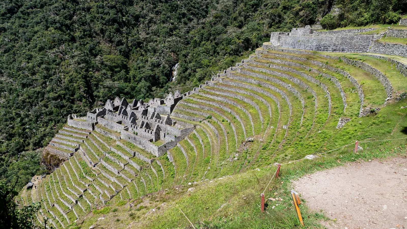 The stone terraces and buildings of Wiñay Wayna on the Inca Trail, surrounded by cloud forest