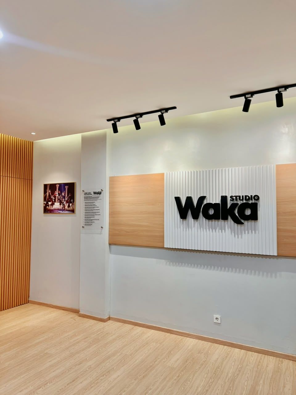 The lobby wall with the Waka Studio sign