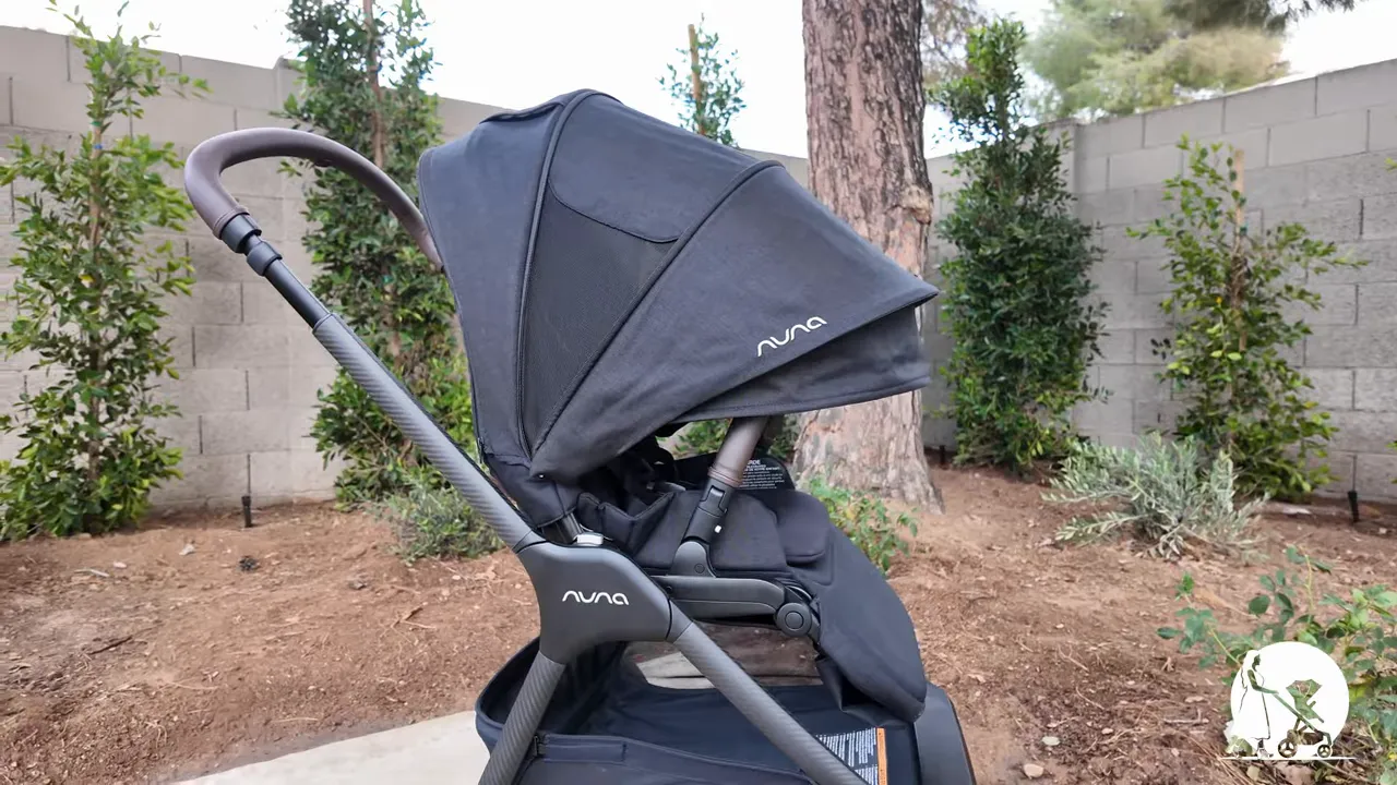 View from parent perspective over the Nuna TRIV LX canopy walking on a sidewalk